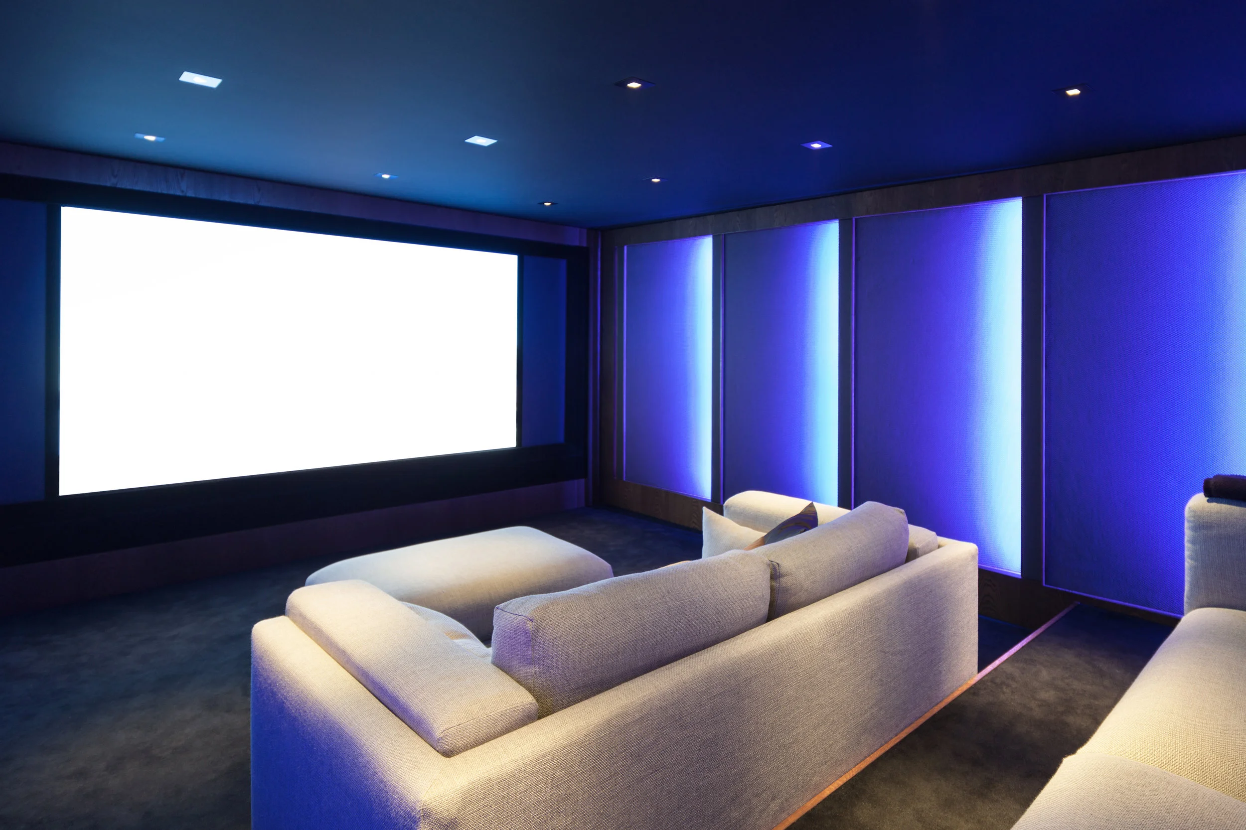 Home-Cinema-Hawkshill-Way-Esher-Blue-walls-Cream-Sofas