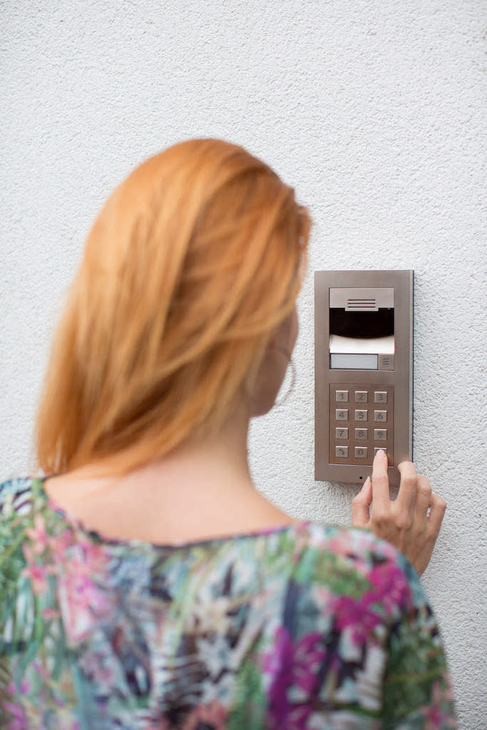 Smart_Home_Security_Control4_Video_Doorbell_Intercom_Anywhere_Red_Haired_Woman_pressing_keypad_brushed_Nickel