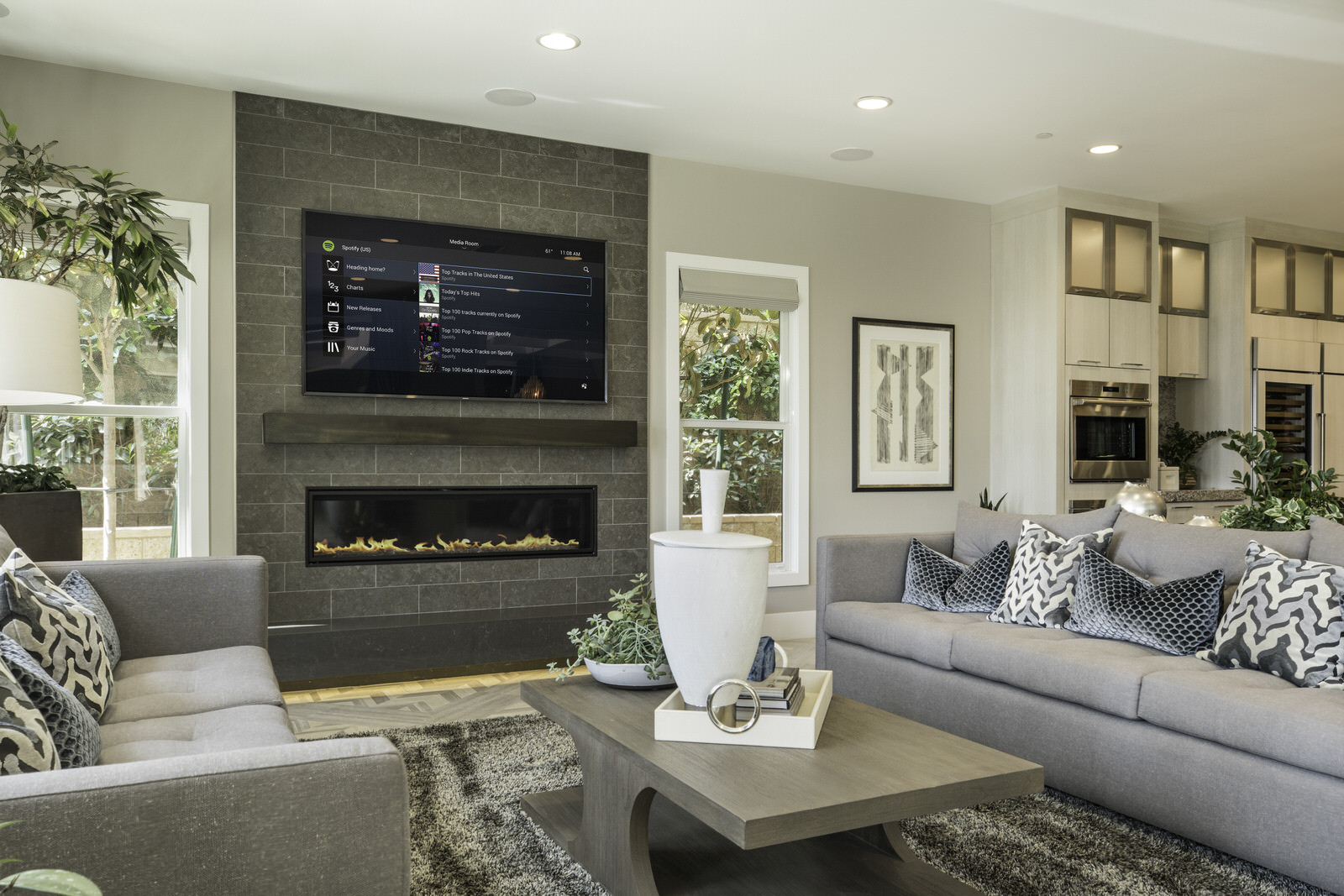Control4_Home_Automation_Living_Room_Modern_Navigator_Grey_Sofas_Charcoal_Tiled_Wall_Brown_Wooden_Floor_Contemporary