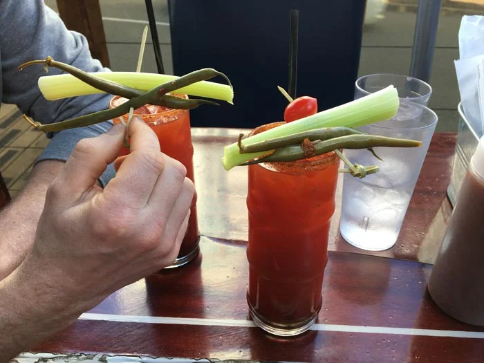 Caesars! (Don’t look up Clamato Juice.)
