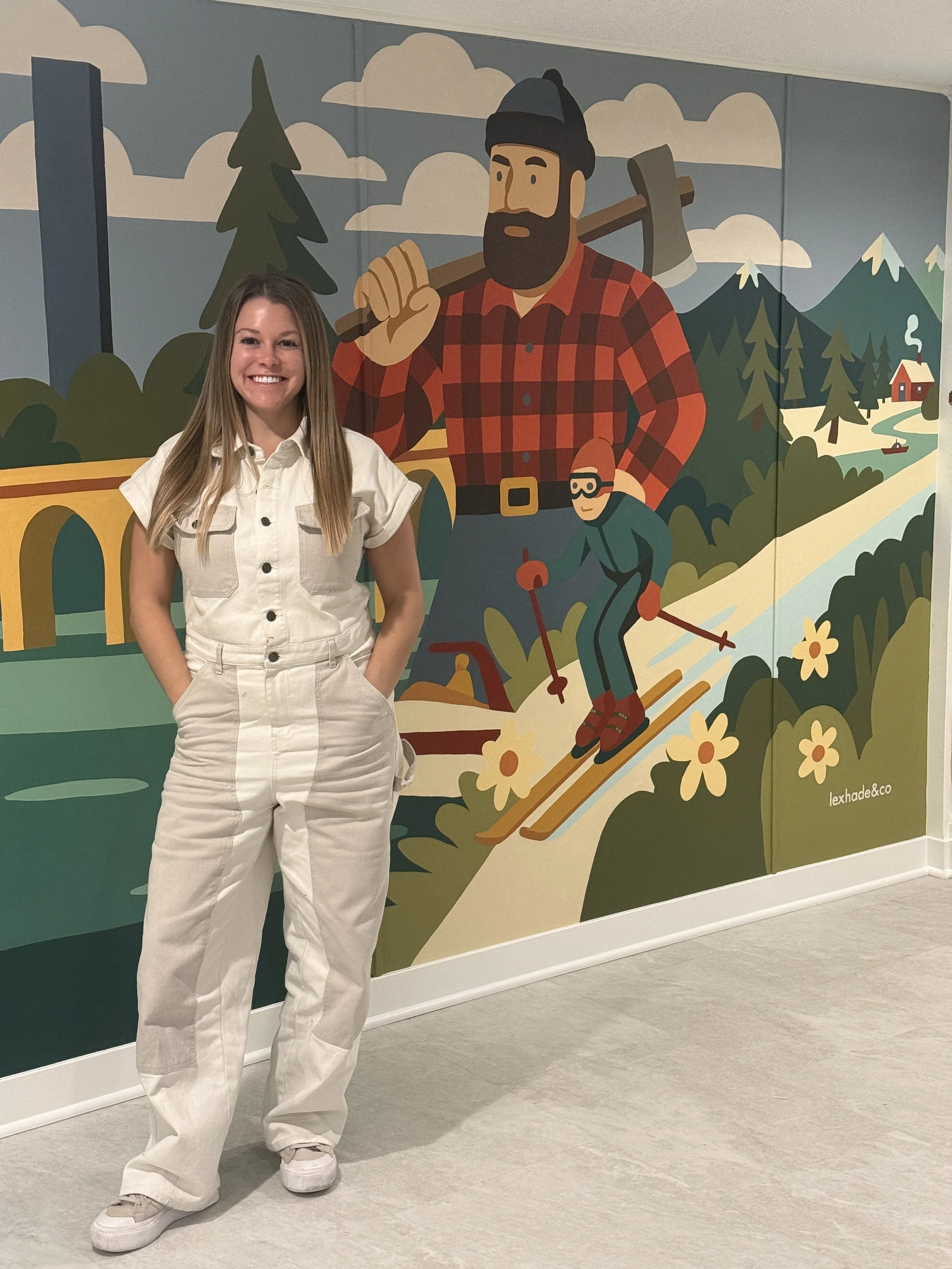 lex with cityscape mural.JPEG