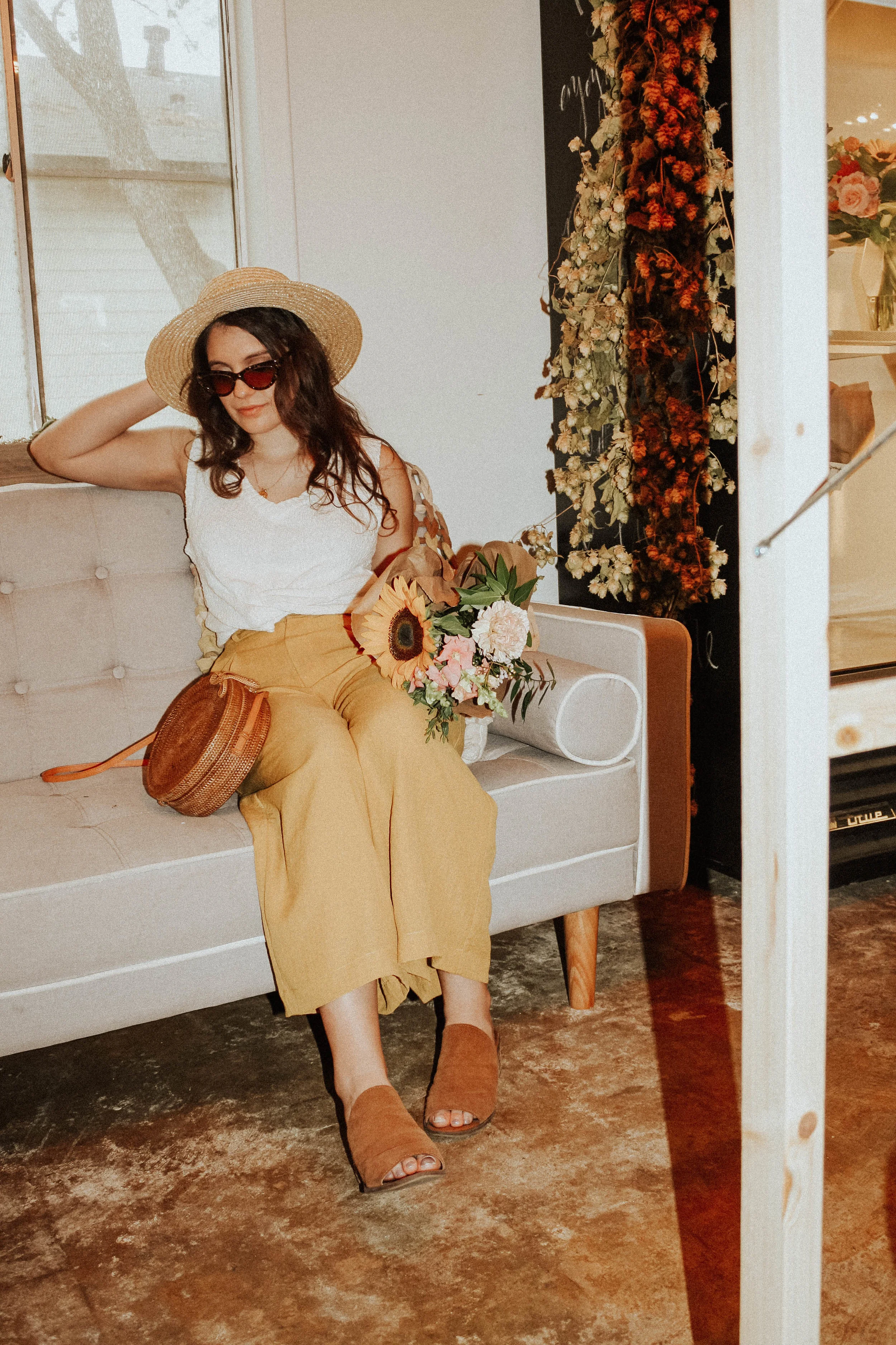 Hat: Lack of Colors; Sunglasses: Amuse Society X D'Blanc; Top: Moon River; Pants: Lost + Wander; Shoes: Steve Madden; Purse: Cleobella