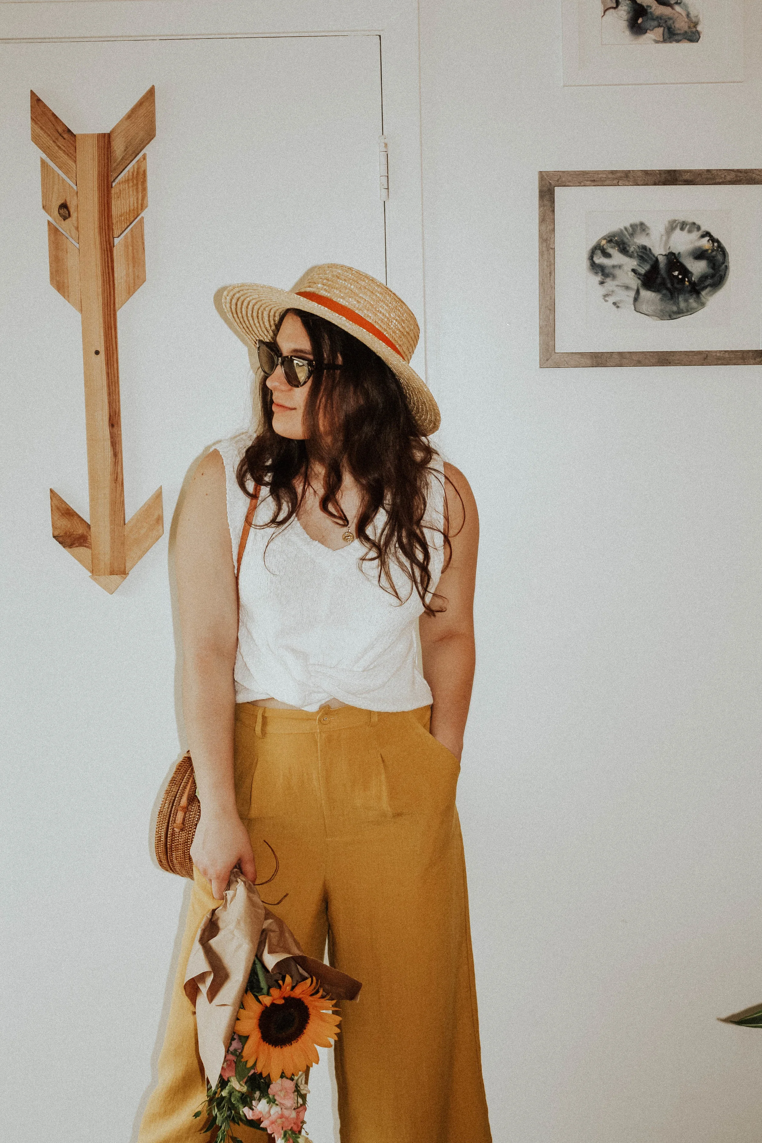 Hat: Lack of Colors; Sunglasses: Amuse Society X D'Blanc; Top: Moon River; Pants: Lost + Wander; Purse: Cleobella
