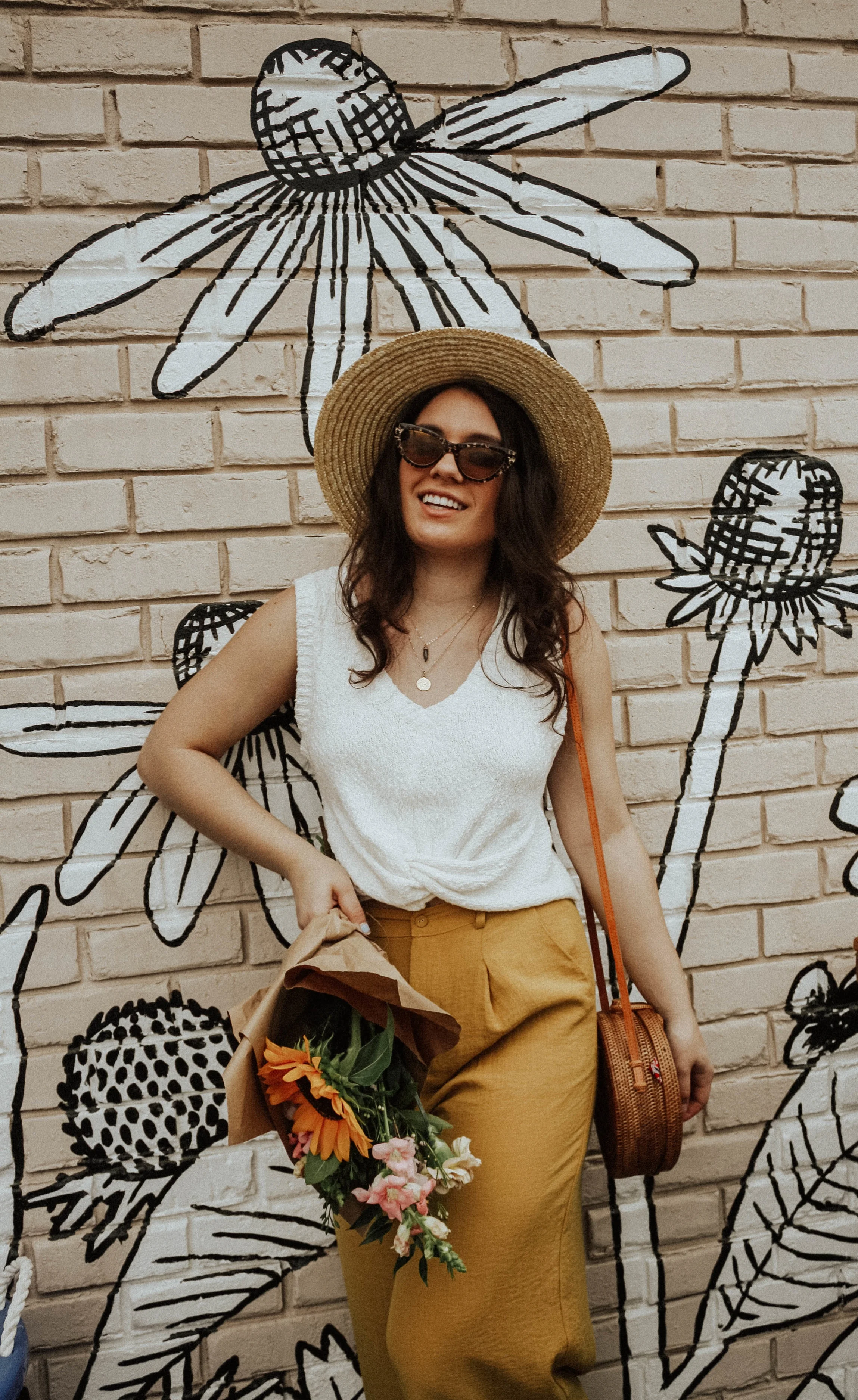 Hat: Lack of Colors; Sunglasses: Amuse Society X D'Blanc; Top: Moon River; Pants: Lost + Wander; Purse: Cleobella; Jewelry: M+M Couture Designs