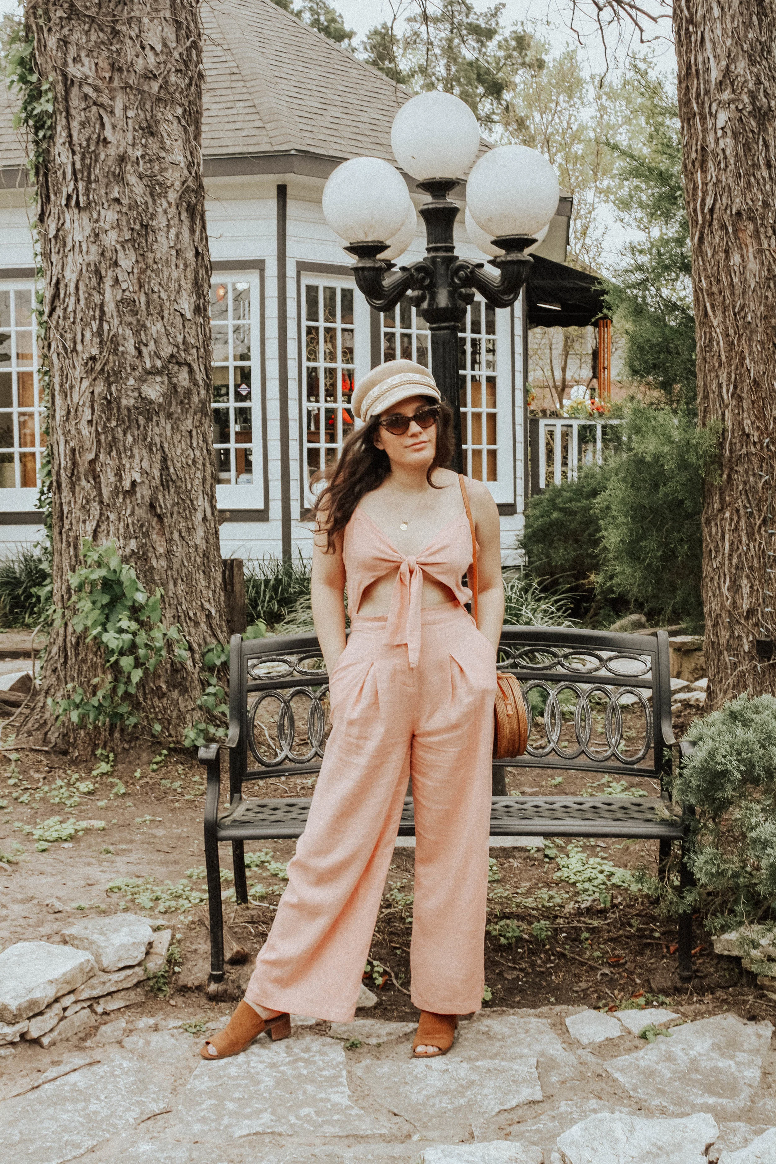 Jumpsuit: Moon River; Purse: Cleobella; Hat: Lack of Colors; Sunglasses: Amuse Society X D'Blanc; Shoes: Steve Madden