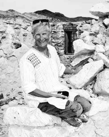 © Richard Stephens/Special to PVT - Belgian artist Cecile Massart sits among the ruins of the Bullfrog jail behind the Red Barn Art Center at Rhyolite.