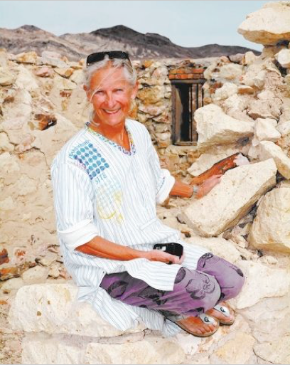Richard Stephens/Special to PVT - Belgian artist Cecile Massart sits among the ruins of the Bullfrog jail behind the Red Barn Art Center at Rhyolite.