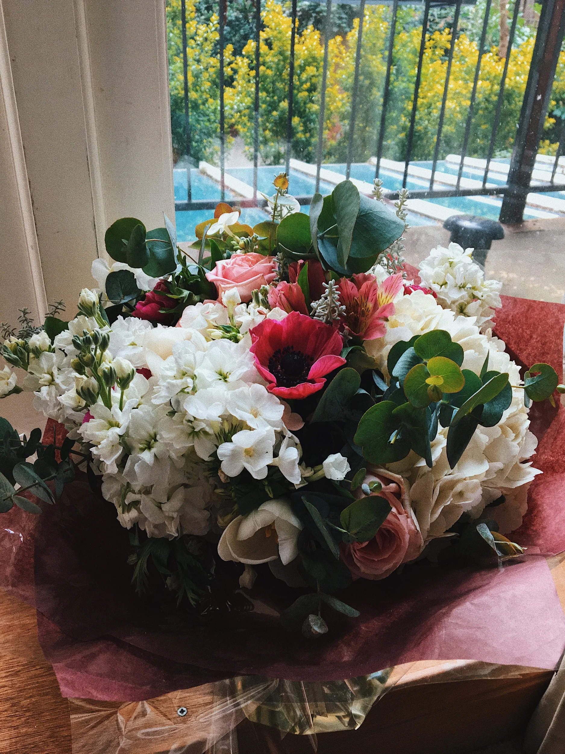 My bouquet packaged and ready to surprise an unsuspecting stranger (the manager of the hotel I was staying in, he looked like he was having a rough week)