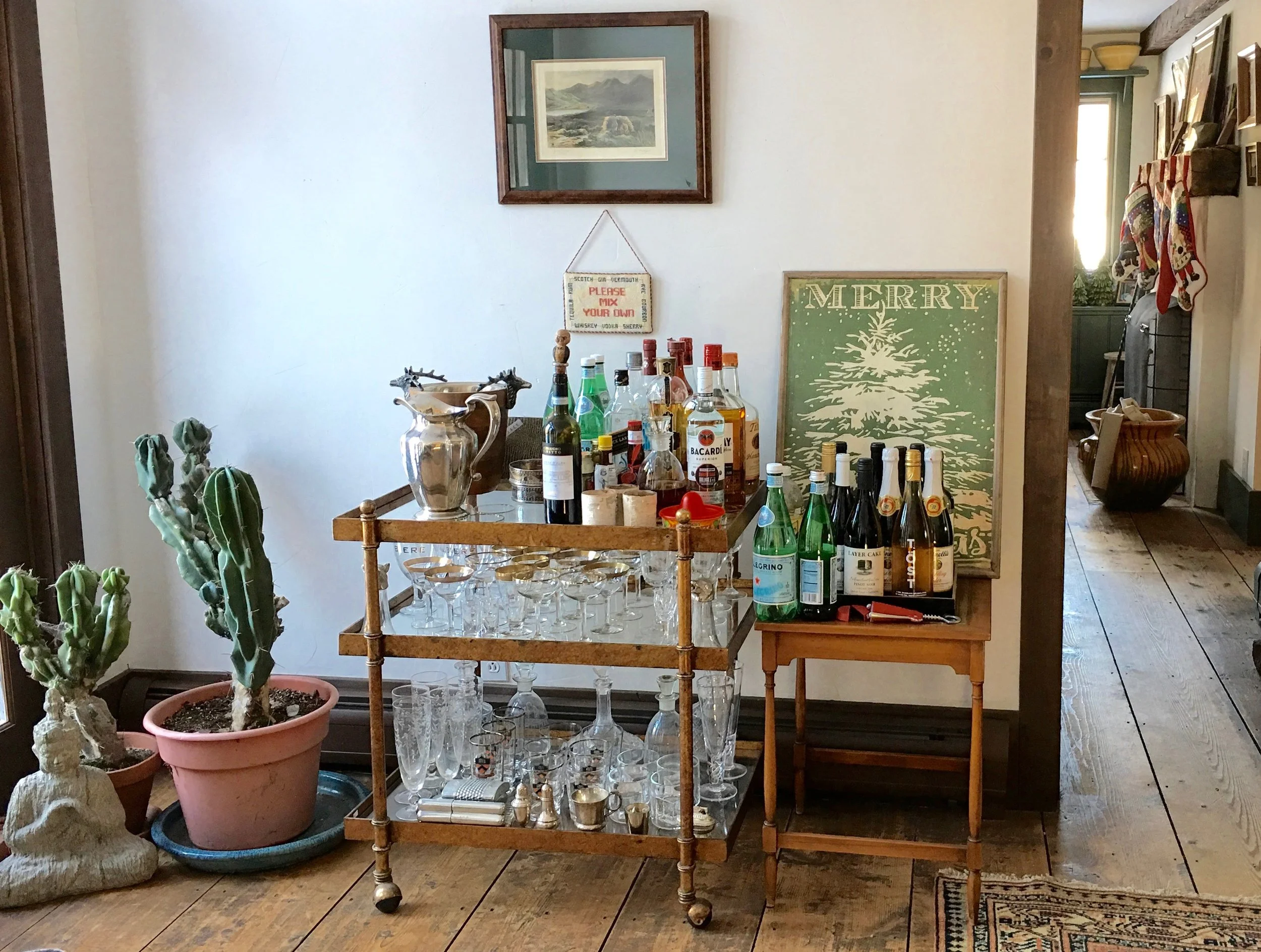 Holiday drinks table all ready for a house full of people and winter storm Ethan! Needlepoint stockings are hung on the kitchen mantle because the living room fireplace has a roaring fire at all times. 