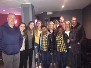 Esther and Jacqueline with their host families in Newton, Massachusetts.