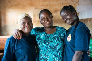 SEGA Graduates and MK Mentors, Susan (left) and Yustina (right), with MK Coordinator Tina (center).