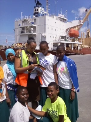 Students at the Dar Es Salaam port with the staff; kneeling, (from L-R standing) Maria John Kwanga and Stella Mswakala at the back (from L-R) Amina Zuberi, Amina Kiondo and Neema John.