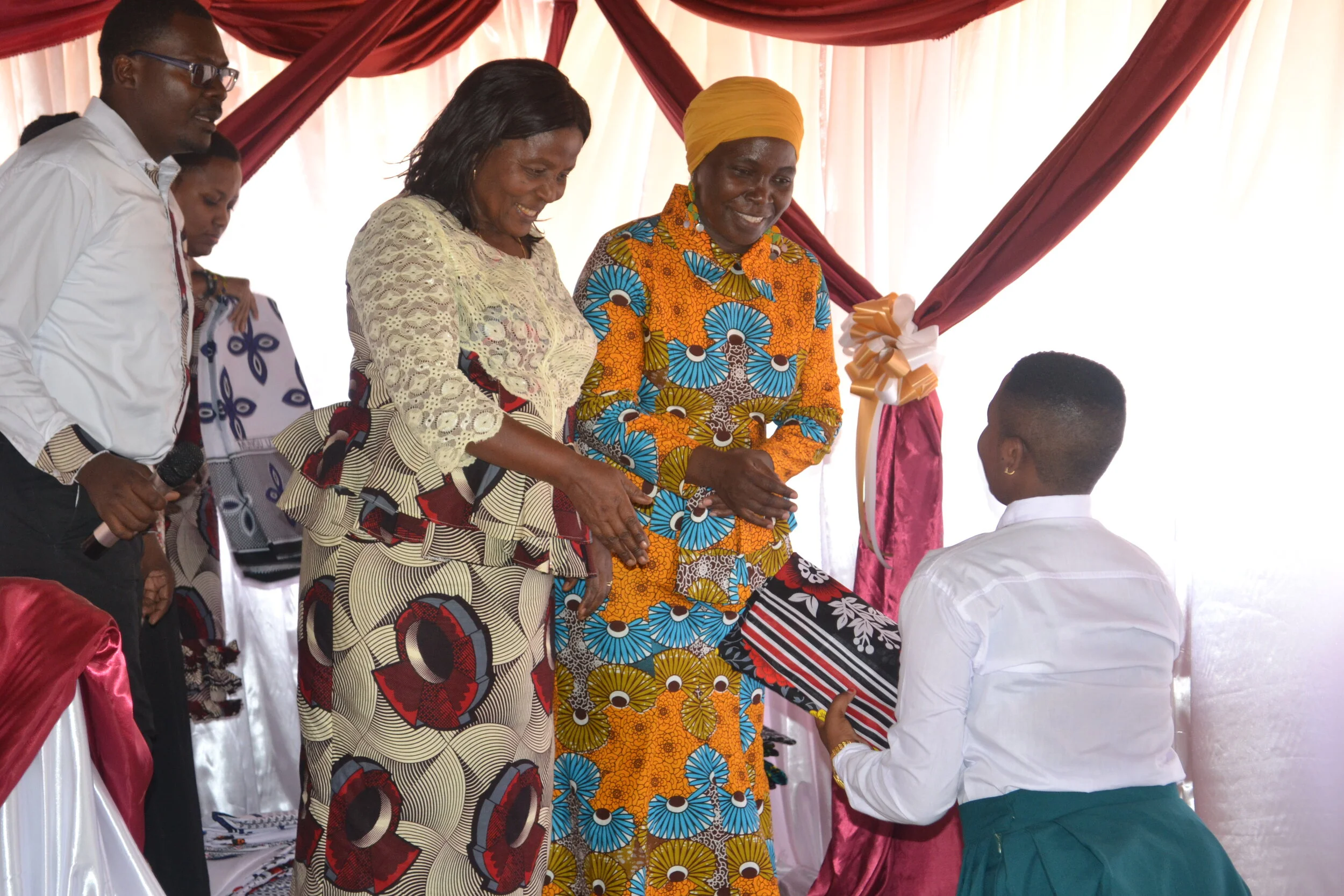  Madam Elly and Guest of Honor Professor Shani Mchepange present gifts to each graduate. 