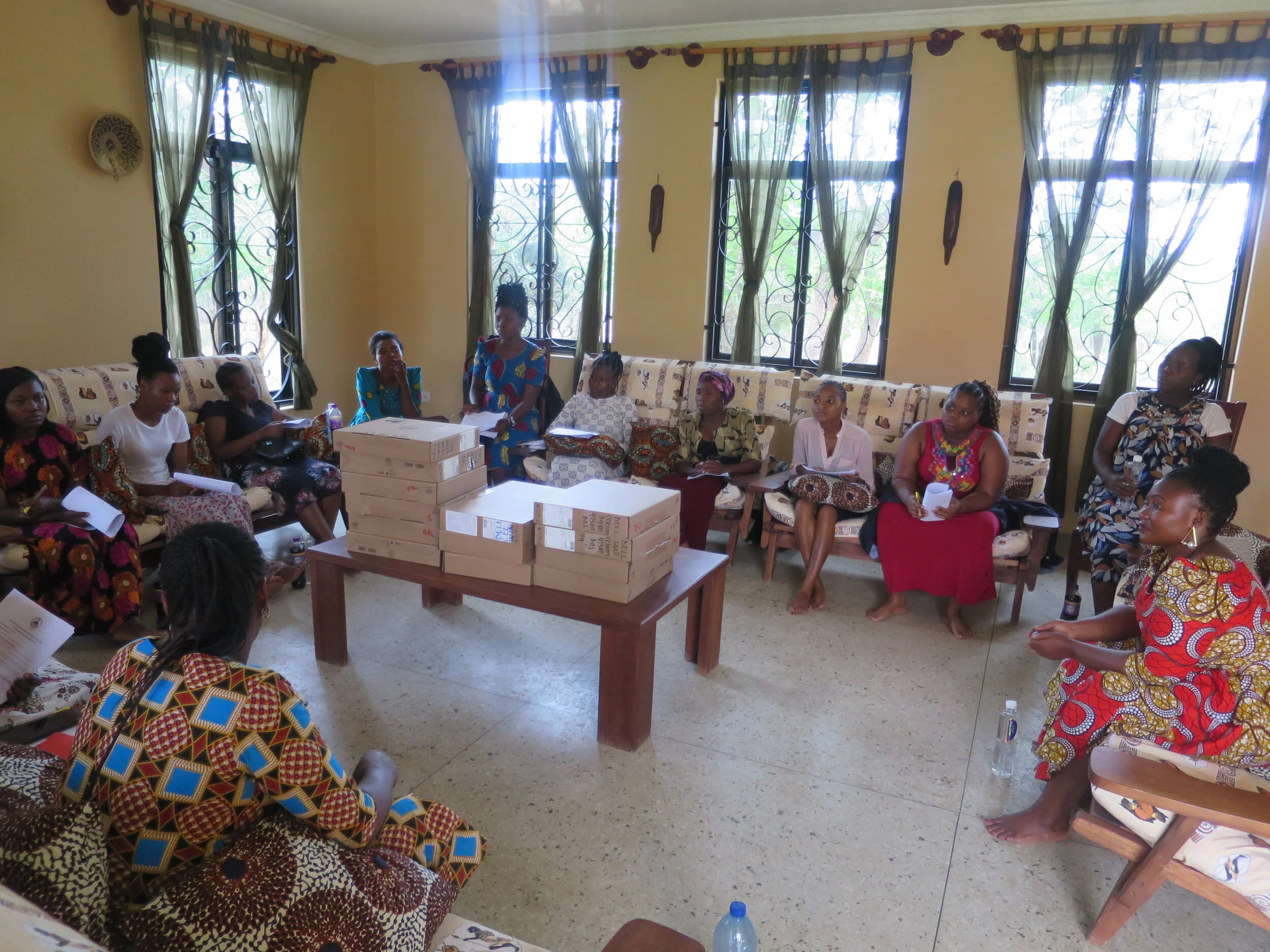 Graduates receiving information about the laptop at SEGA.