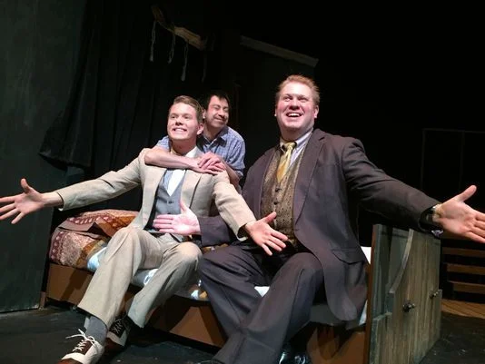 The Man in the Chair (Peter Kao) hugs Robert (Benjamin Johnson) performing in the Man's favorite musical along with George (Michael Skocir, right) in a scene from Waukesha Civic Theatre's "The Drowsy Chaperone." (Photo: WCT/submitted)