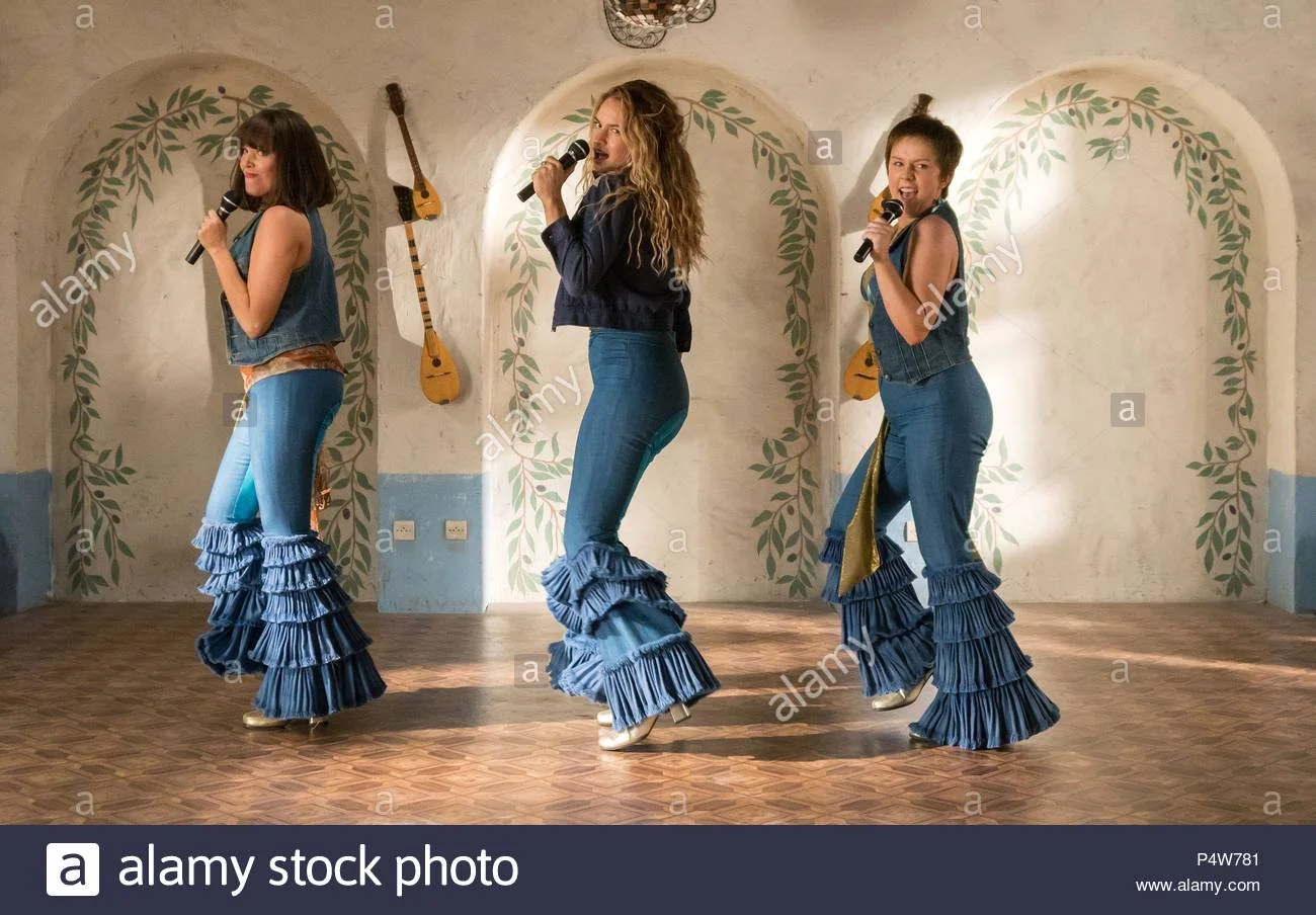 Jessica Keenan, Lily James and Alexa Davies play the young Rosie, Donna and Tanya in "Mama Mia: Here We Go Again."