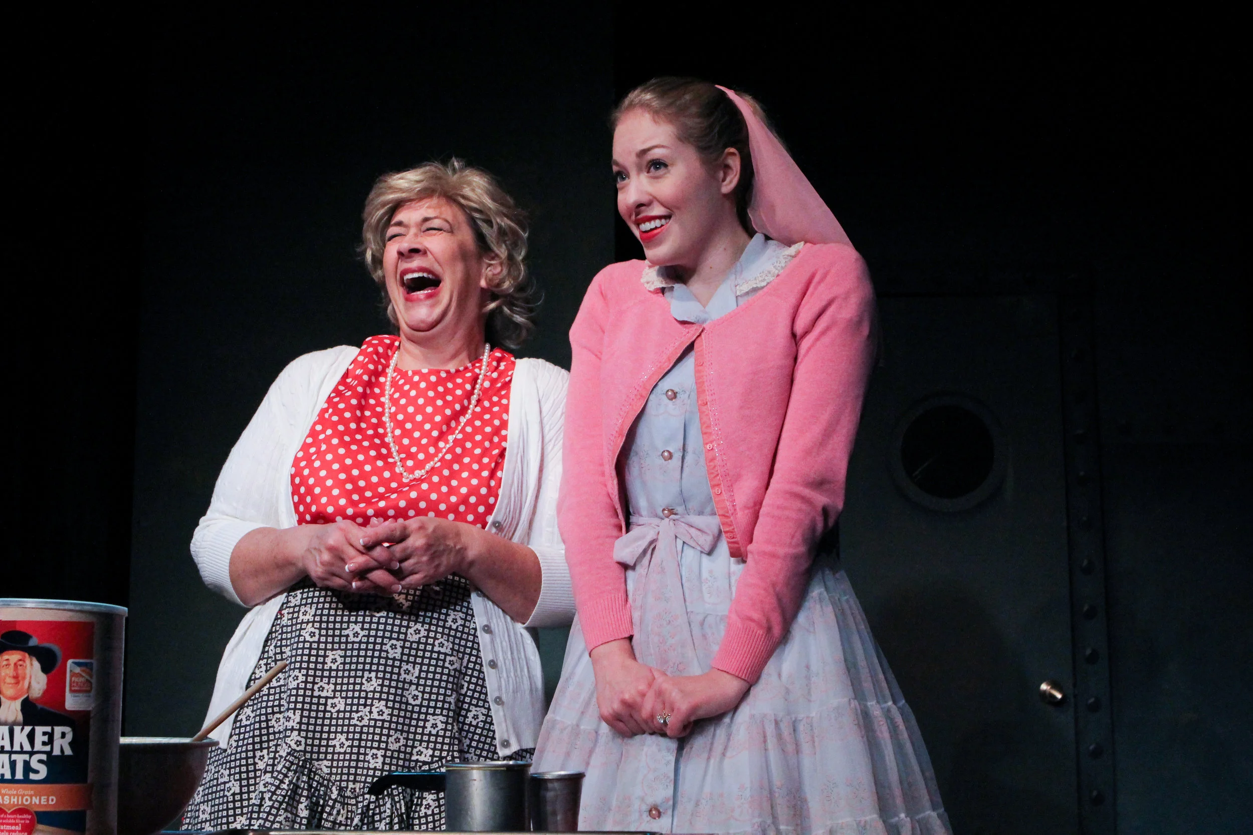 Mrs. McCarthy (Rebecca Richards) shares a light moment with her daughter, Lynn (Stephanie Nilsen), in a scene from Lake Country Playhouse’s “Red Herring.”