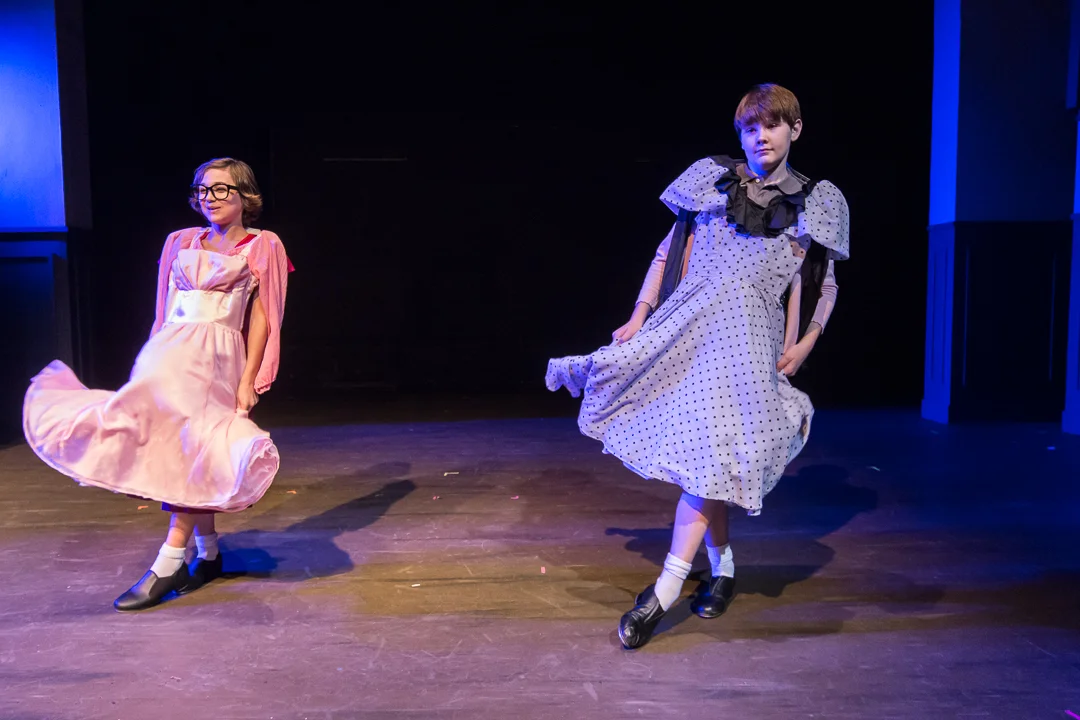 Michael (Liam Thomas), left, and Billy Elliot (Ryan Vanselow) dance in dresses from Michael’s sister’s bedroom in the “Expressing Yourself” scene.