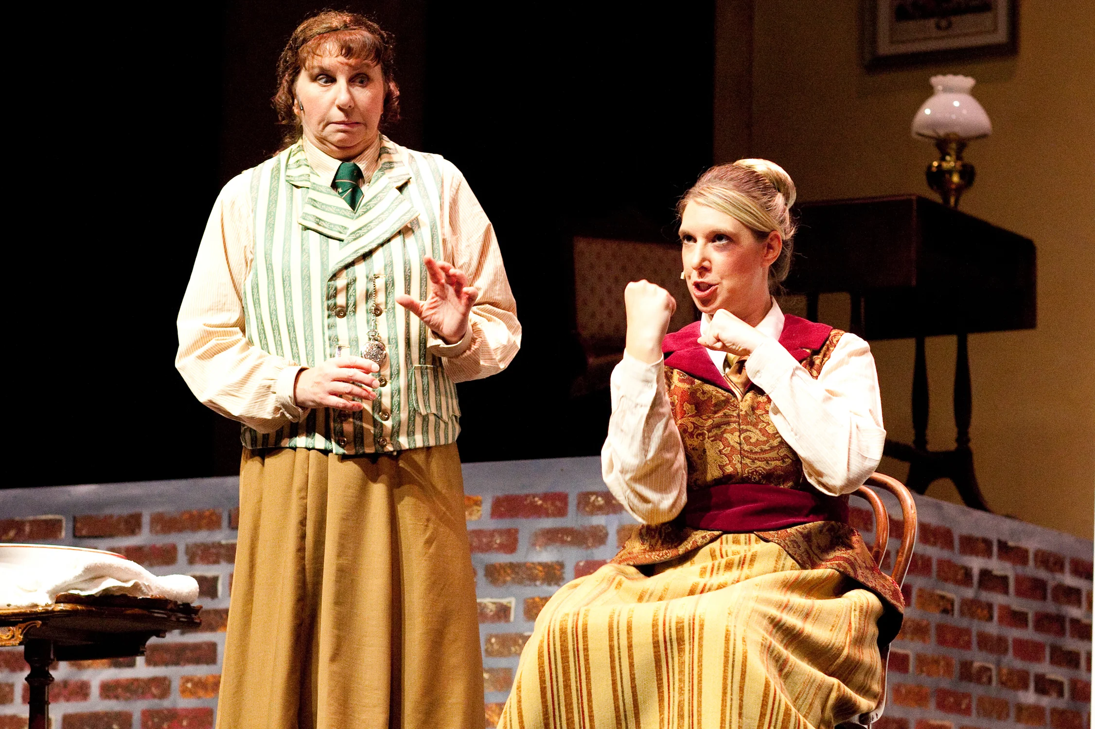 Watson (Karen McKinney, left) and Holmes (Lori Nappe) plot strategy in Falls Patio Players “Miss Holmes.”