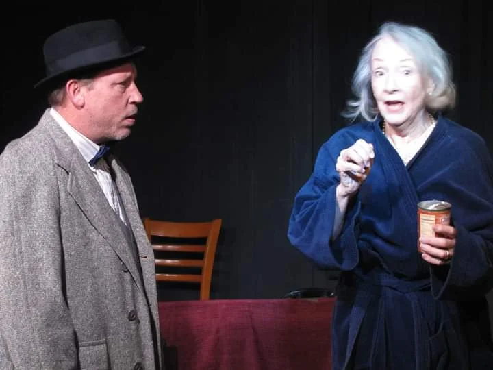 Daisy (Mary Buchel) complains to her son, Boolie (Scott Sorenson) that her driver has stolen a can of salmon in a scene from Village Playhouse’s “Driving Miss Daisy.”