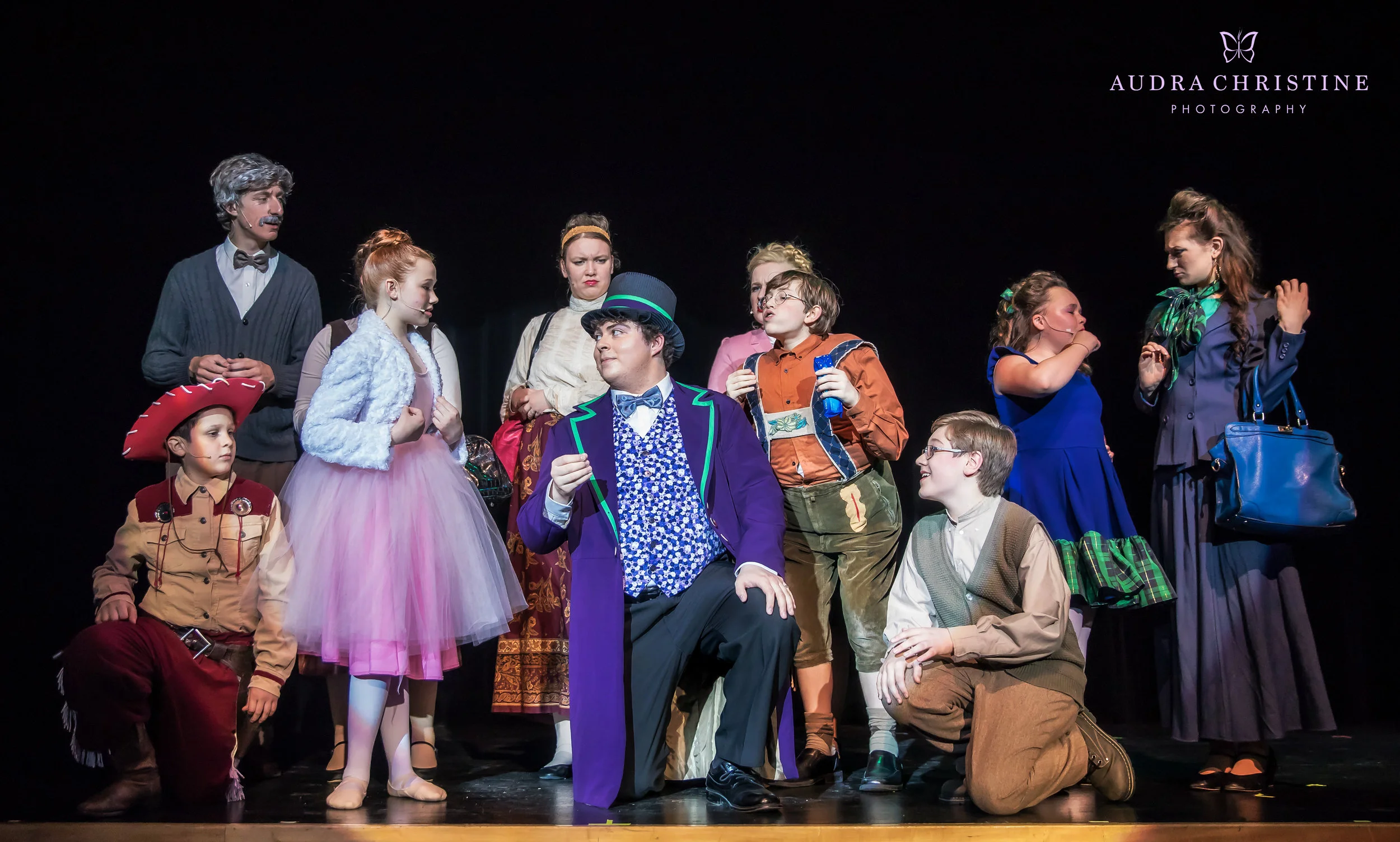 Willy Wonka (Dan Canadas), center, is surrounded by all the children and their chaperones who tour his candy factory including, from left, Mike Teavee (Orlando Corchado), Grandpa Joe (David Wagenknect), Veruca Salt (Emily Struebing), Mrs. Gloop (Amanda Franz), Mrs. Salt (Mackenzie Joranlien), Augustus Gloop (Cavan Fuller), Charlie Bucket (Mitchell Anderson), Violet Beauregarde (Ella Connelly) and Mrs. Beauregarde (Rachel Van Nice. “Willy Wonka Junior” was presented by Christian Youth Theatre (CYT) May 24-26 at Schauer Arts Center in Hartford.