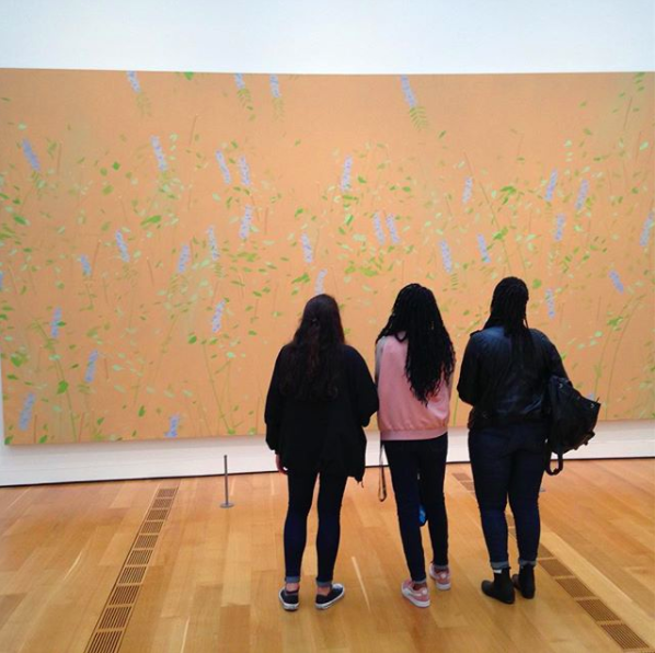 Students from "Poetry, Painting, Film, and Music in New York City" viewing Meadow (1997) by Alex Katz at the High Museum of Art in Atlanta.