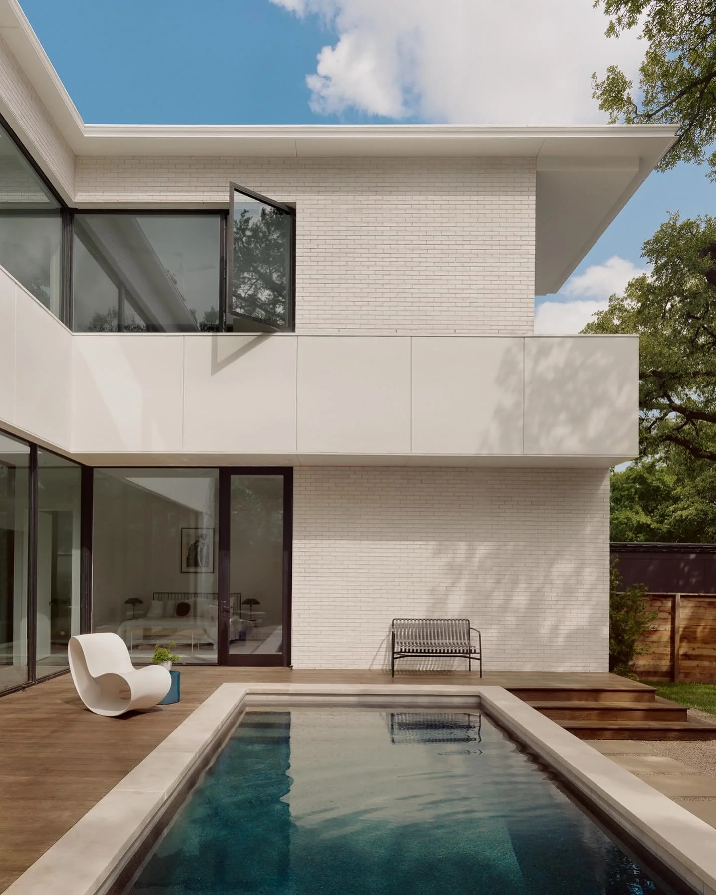 One of my favorite features of this house is the functional outdoor living space. It has two exterior courtyards, one thats centered around a heritage live oak and stays shady all day. The pool courtyard feels very private and gets great afternoon su