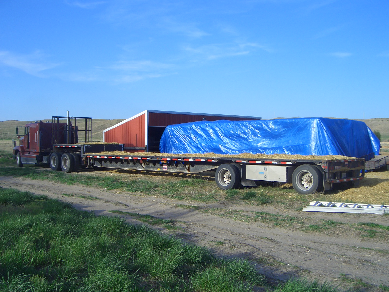 Bales unloaded and tarped