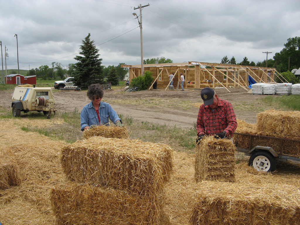 Barb & Buddy squaring off the bale ends so they fit together without gapping