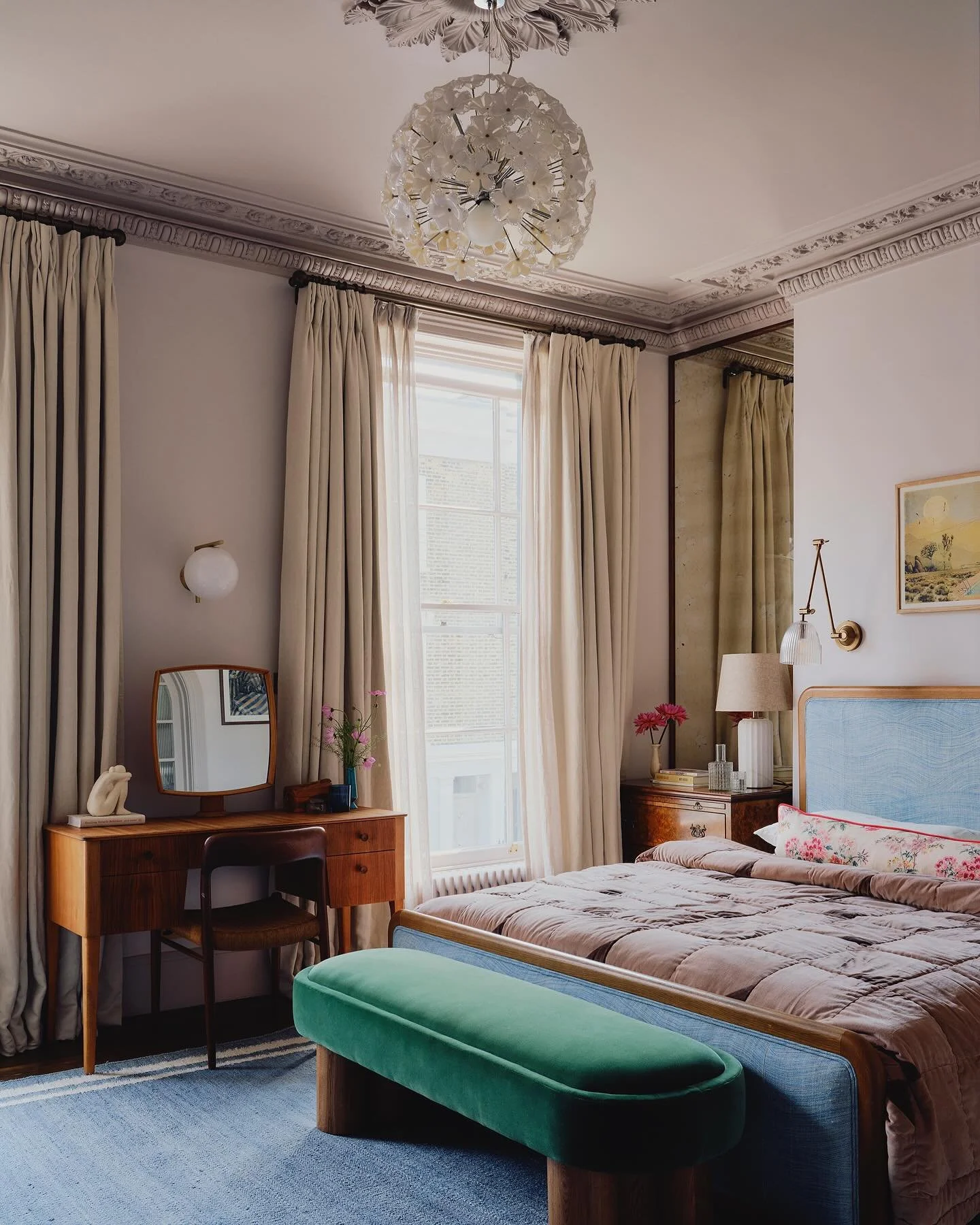 The bedroom of a recently completed project. 

We added a wall of linen panelled wardrobes to give ample storage and bring in some softness. Walnut framed antique mirrors fill the alcoves and highlight the stunning ceiling heights and reflect the pre