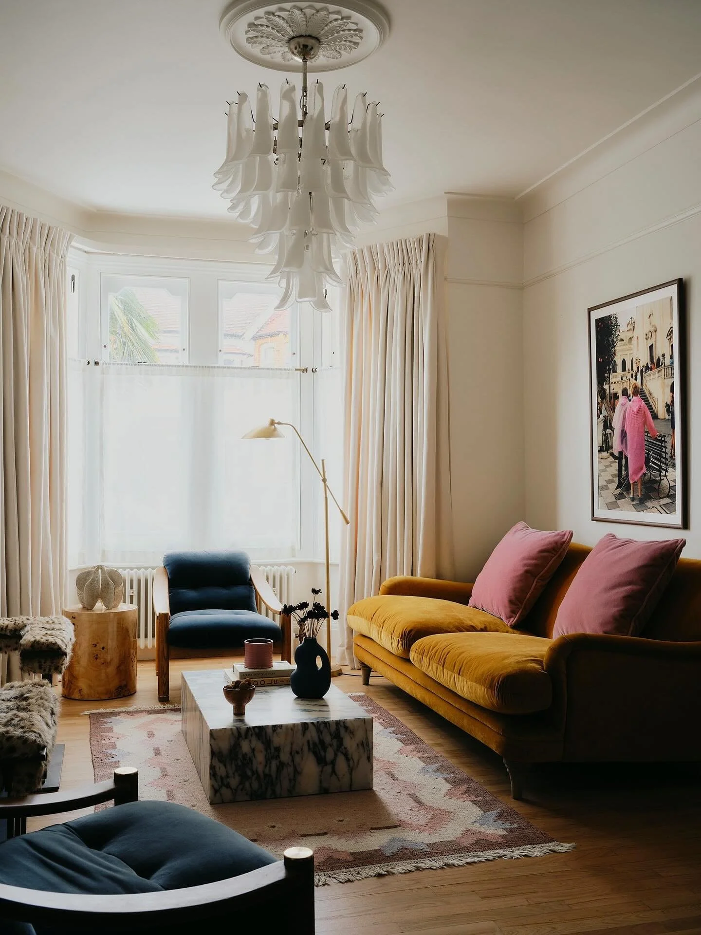 Some outtakes from the living room in our Dulwich project. Soft neutrals, warm velvet, and sculptural details ✨ A bright living room full of tactile elements - where mustard, blush, and deep blue velvets meet richly veined marble, characterful wood, 