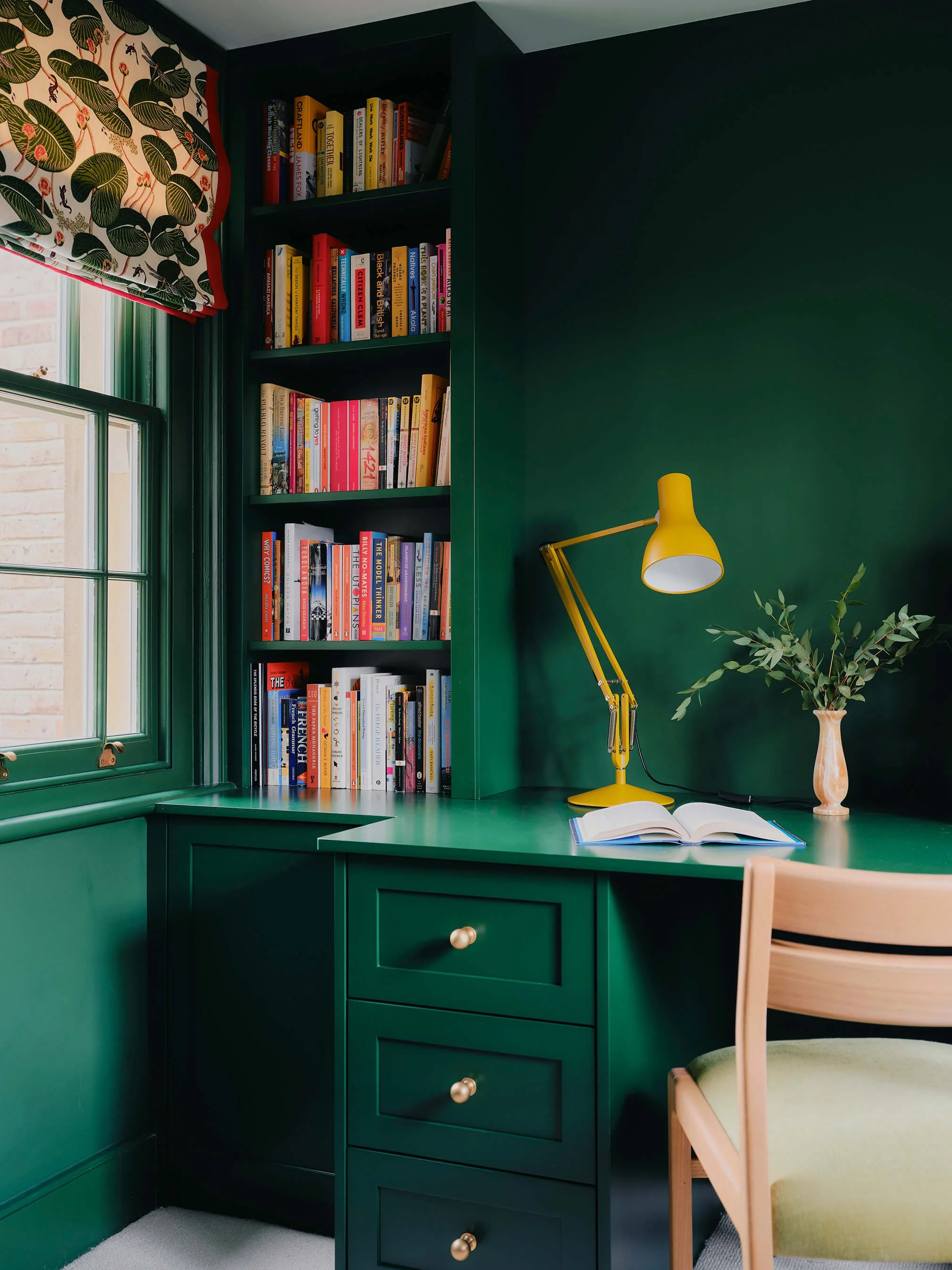 Emerald Green Study, with desk and filled bookshelves.