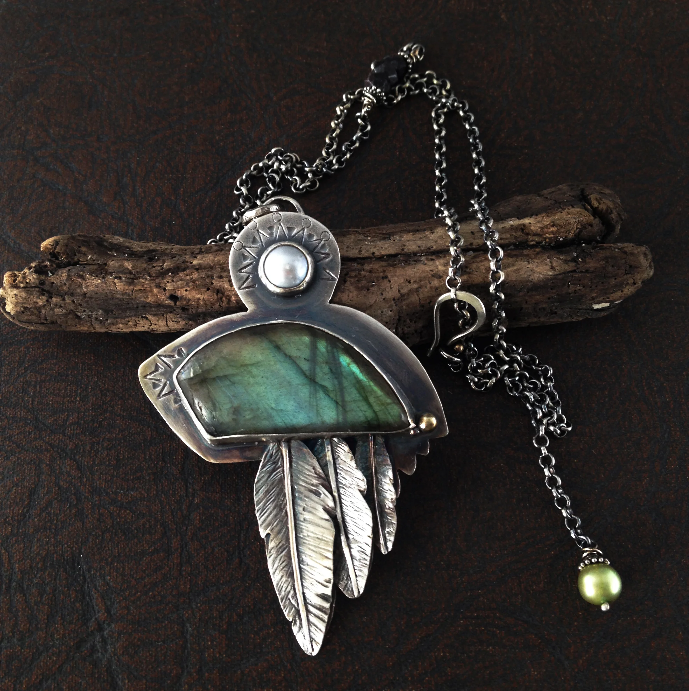 This necklace is so special to me. I love herons and I feel that this pendant truly captures their essence. I enjoy the details along the chain itself and the unique clasp. -Aspen
