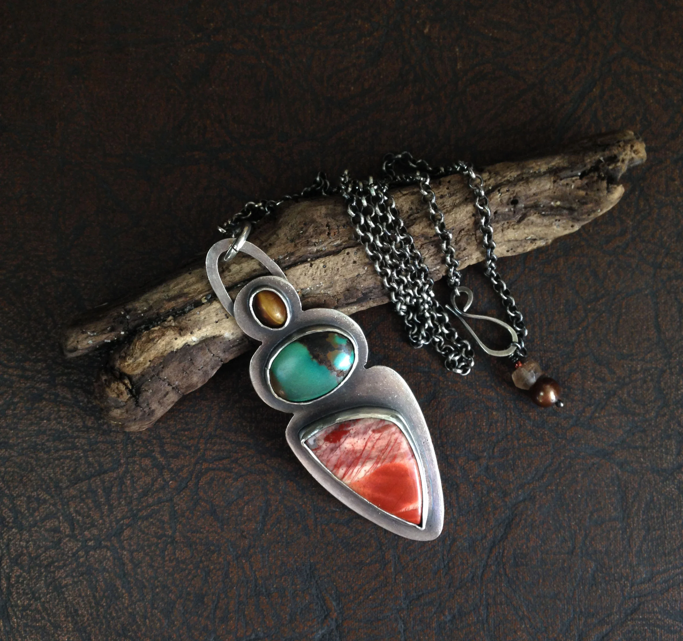 I love this necklace! The colors are so cool together. It is quite striking. I've been considering three or four necklaces from this shop, but couldn't narrow down my favorite. Luckily, the artist was having a sale so I was able to get two! -Christine K