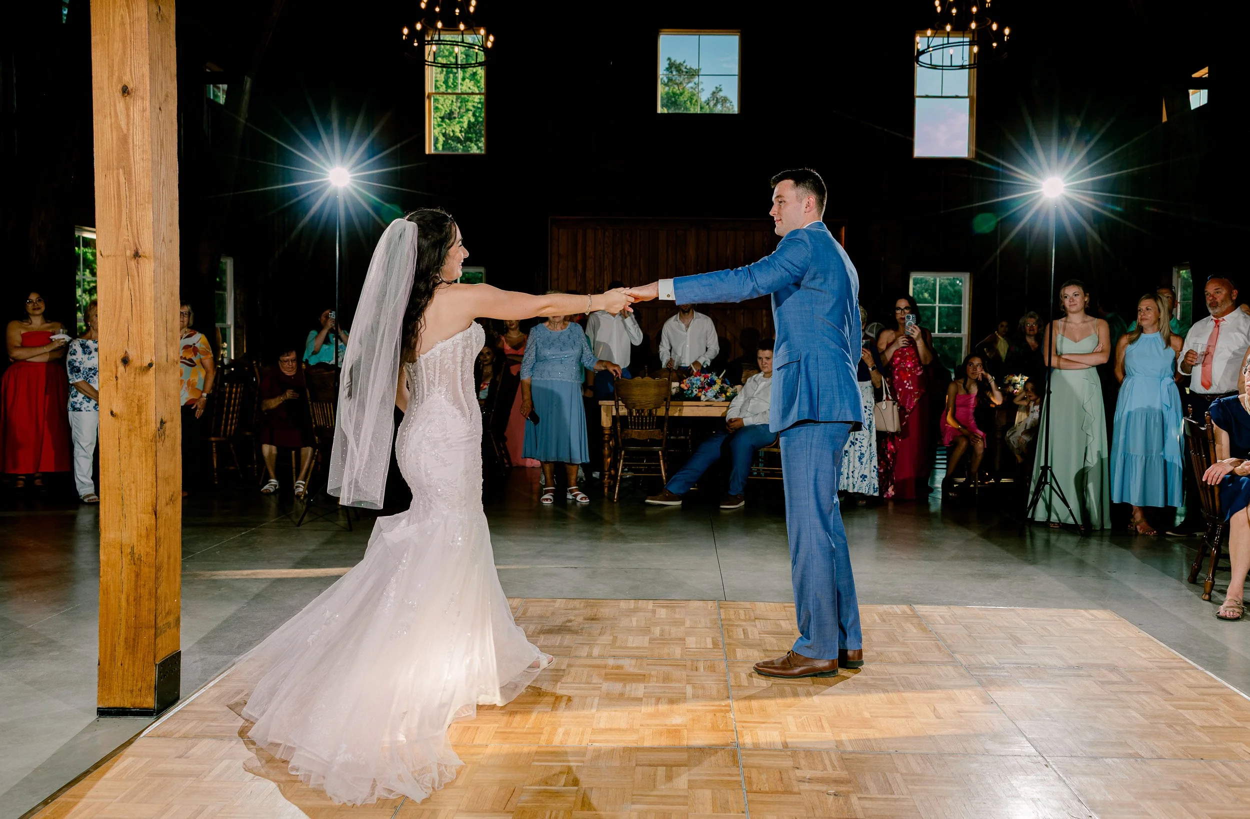 Bride and Groom dancing with spotlights on them