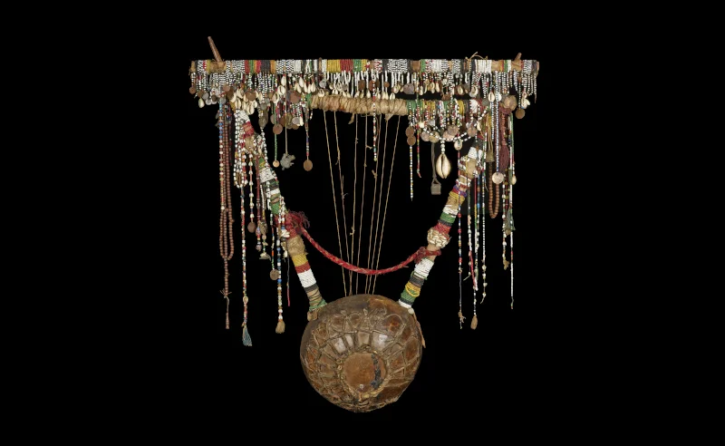 Sudanese Iyre made of wood, skin, glass, cowrie shells, metal and animal gut. Sudan, late 1800s