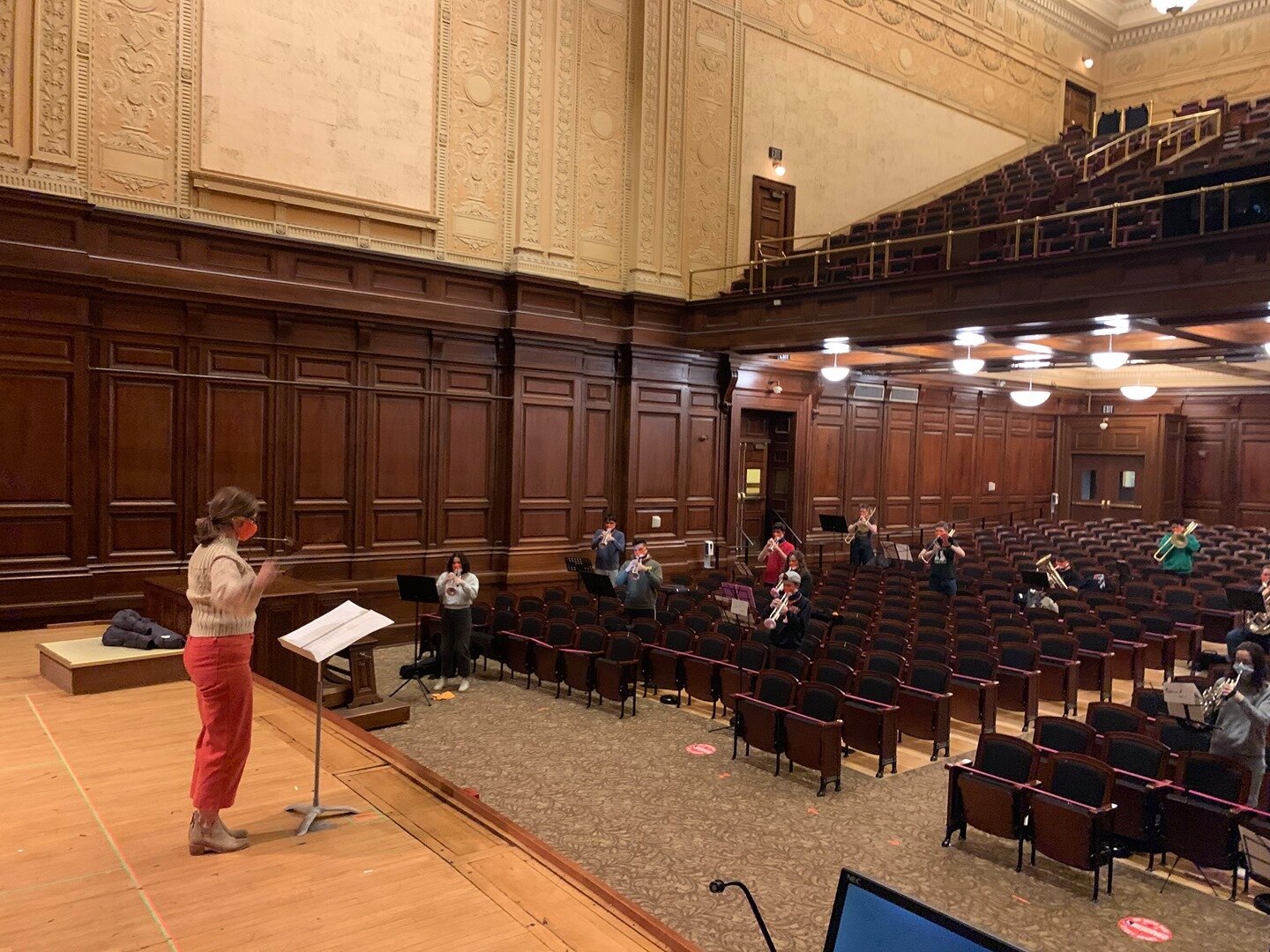 Brass members of the Wind Orchestra and Hindsley Symphonic Band have been gathering to form a brass choir this semester which rehearses in beautiful Smith Recital Hall. Dr. Beth Peterson is seen here leading the group in the rehearsal of &quot;Firewo