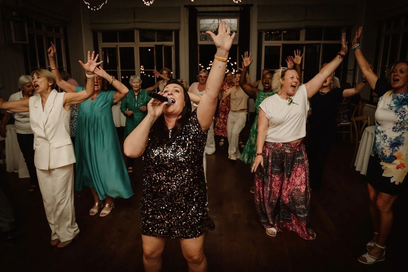 Soulstar Music full 6 piece wedding band with sax and keyboards performing a high energy party set to a packed dance floor at a wedding at Larmer Tree Gardens, Dorset/Wiltshire