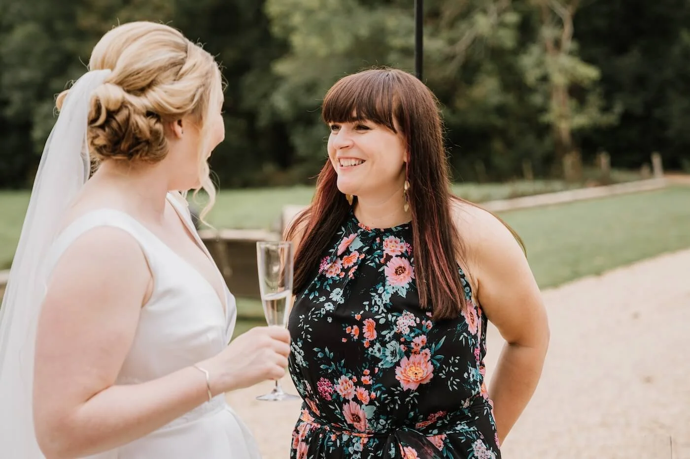 Katy Palmer from Soulstar chatting with a bride during a wedding drinks reception at Pylewell Park, Lymington, Hampshire