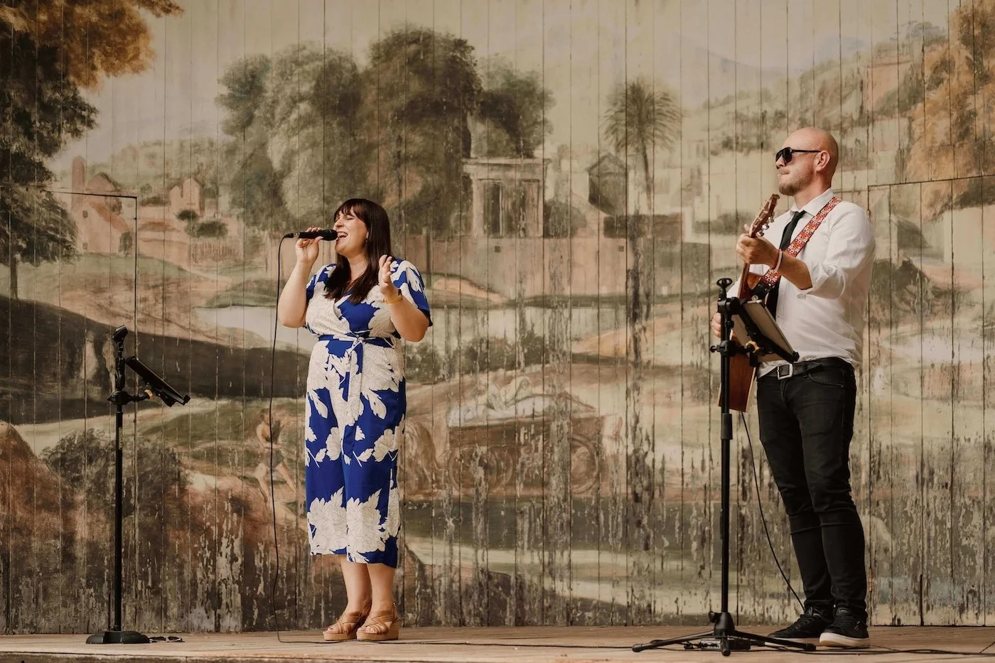 Katy Palmer from Soulstar Music, performing for a wedding drinks reception with acoustic guitarist, Paul Williams, on The Singing Theatre at Larmer Tree Gardens in Wiltshire, Dorset.