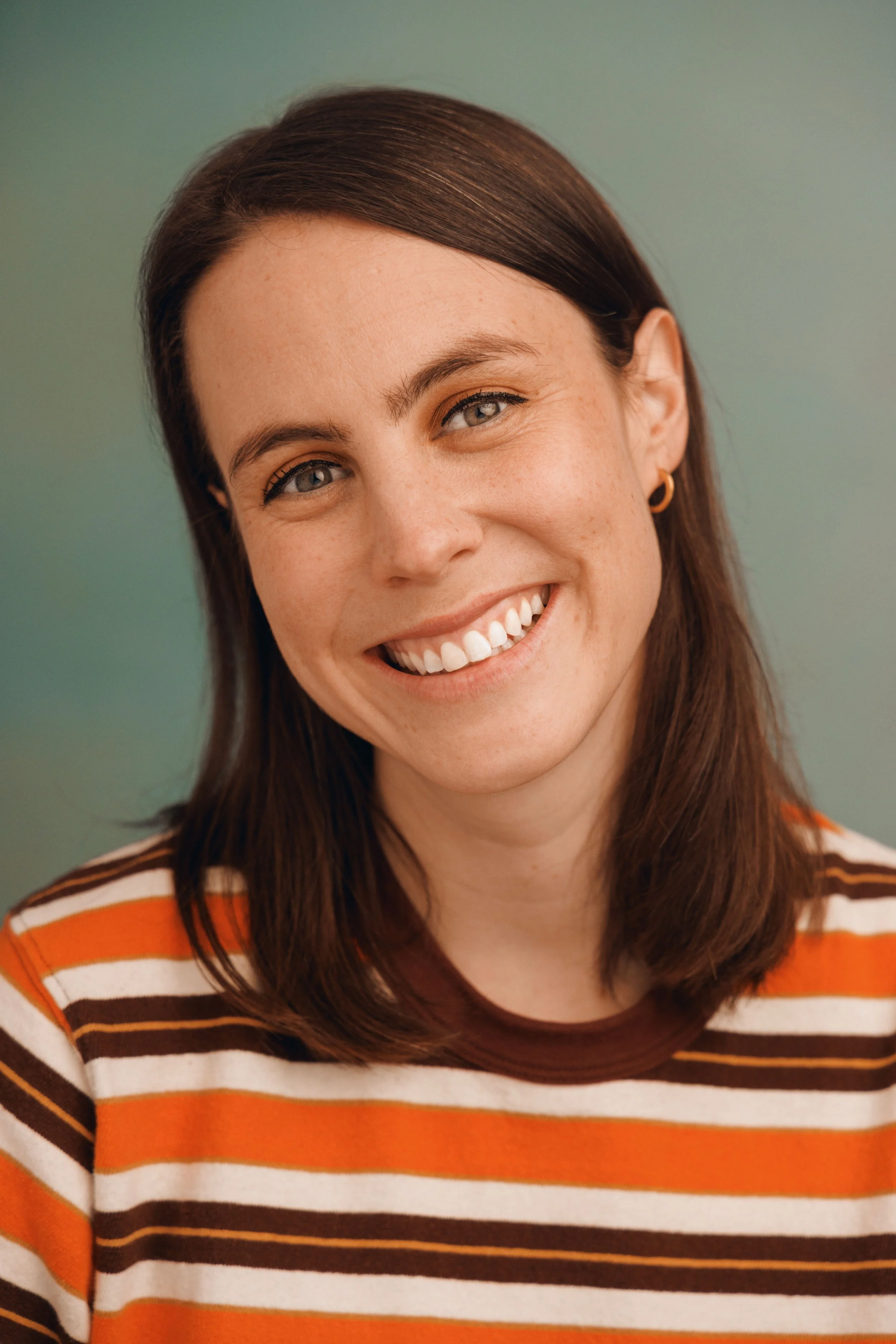 stripe shirt headshot copy.jpg