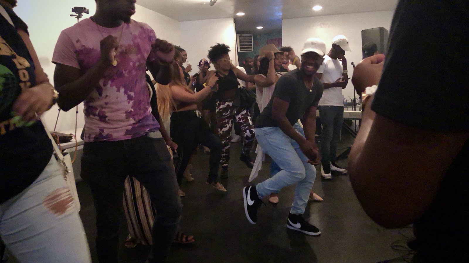 Attendees of the meetup take a quick break to relax and dance before the artists start performing / Voiceless Music Meetup (PHOTO: Regan Hsieh)