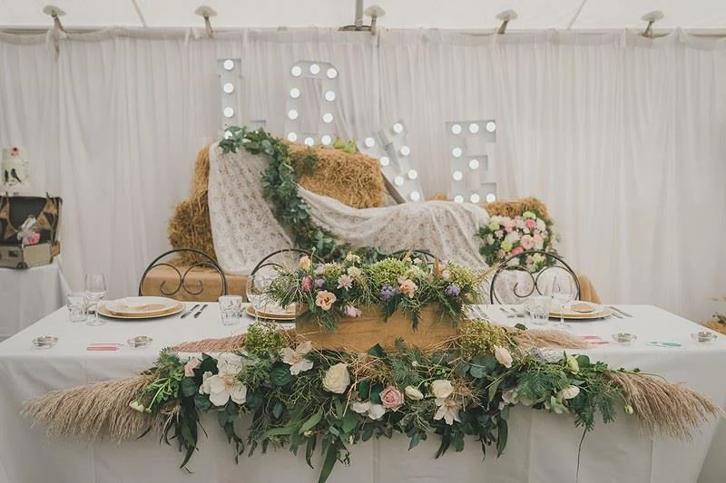 straw and greenery setup