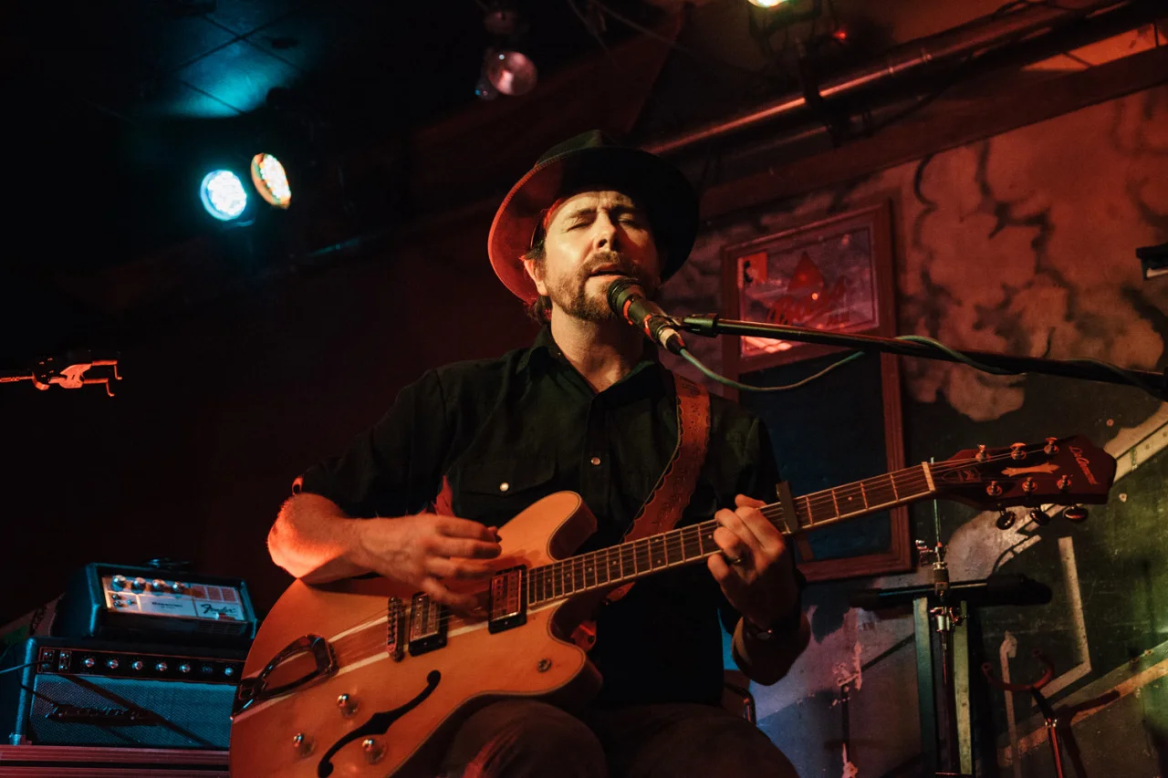 I was so happy to catch one of my favourite bands, Elliott BROOD , while they were in town, performing at (of all places) The Railway Club. The venue was jam packed but I politely elbowed my way to the front (constantly apologizing and gesturing towards my SLR), and grabbed some shots. There are a few more on the blog over on 3am Revelations .