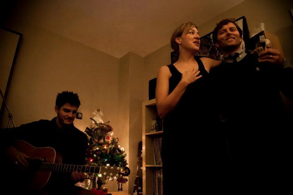 The wonderful Grant Lawrence wrote a post on his blog about selling his old apartment in English Bay . Part of it was about having musicians play his annual Christmas party, and I loaned him some of the photos that I took there.
Above is Grant and Jill, with Mr Dave Vertesi from the last xmas party in the apartment.
I’ll miss yelling up at the balcony after a movie in Stanley Park…