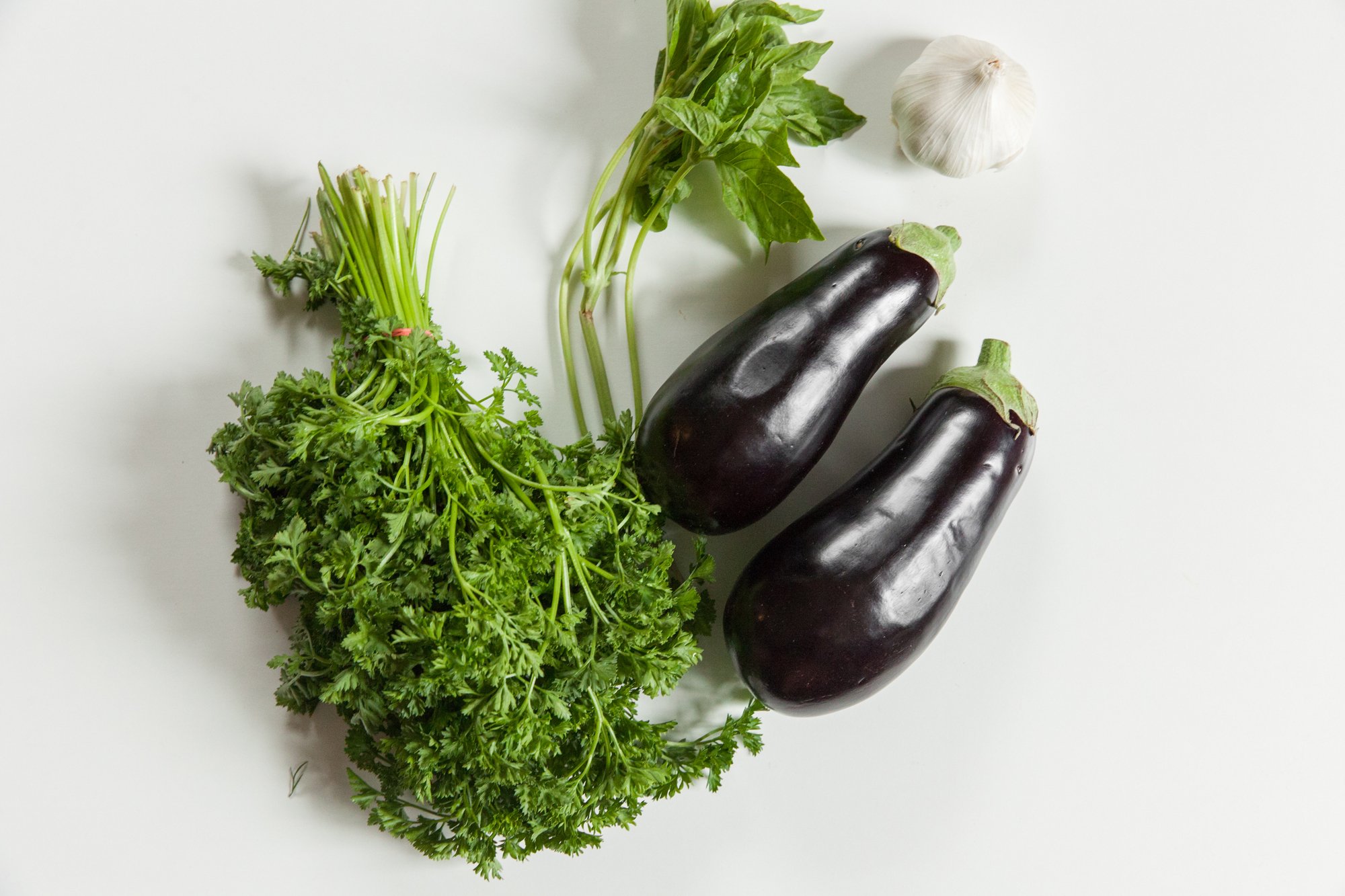  Eggplant, Basil, Parsley, and garlic on white 