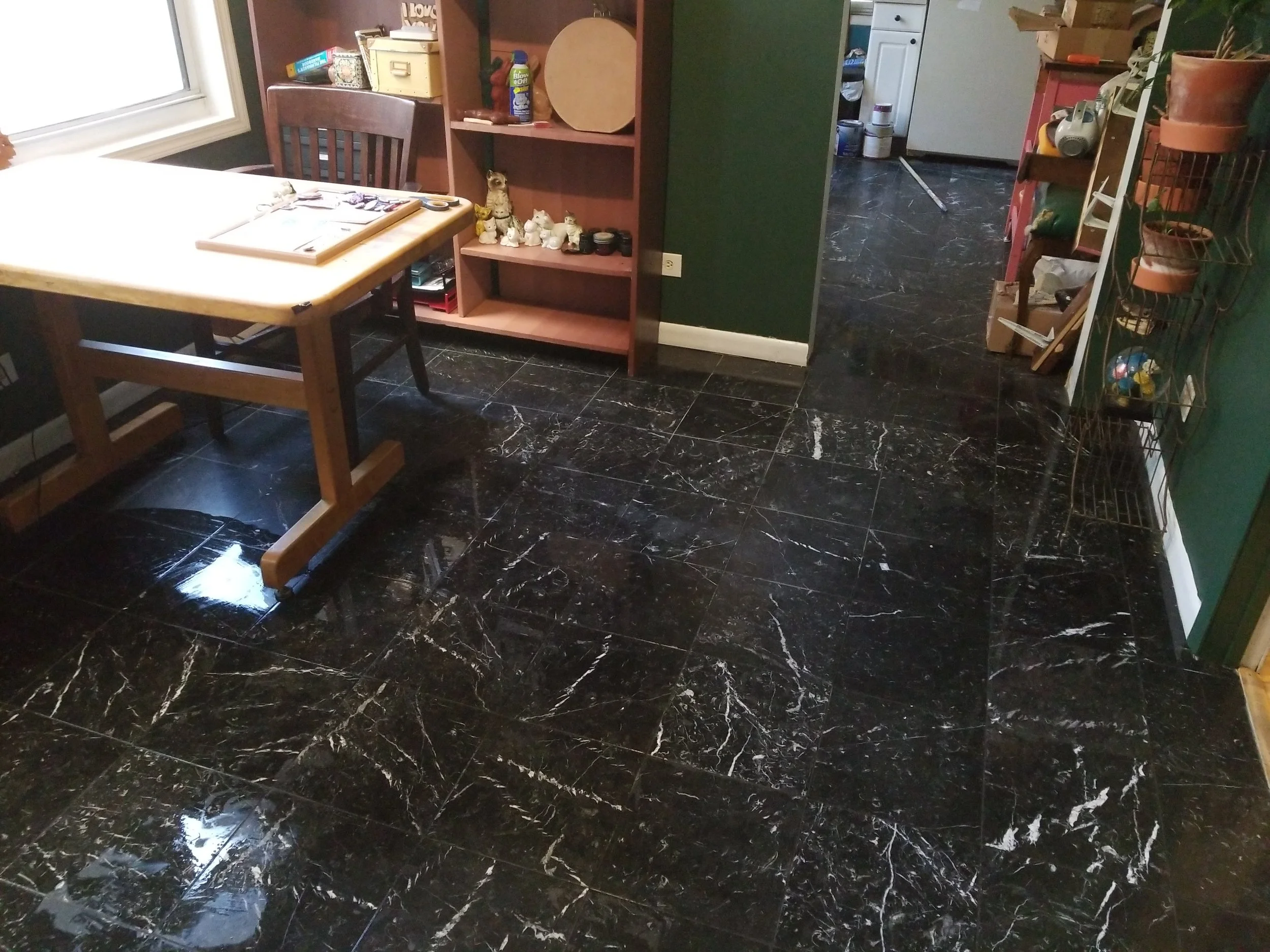 I cleaned the floors with some mild soap and water. I can not WAIT until they’re buffed and shiny - They’ll look like they do when they’re wet, here. I did buy a beautiful red 7’ x 10’ area rug for this room for an insanely cheap price. What color curtains do I put up???