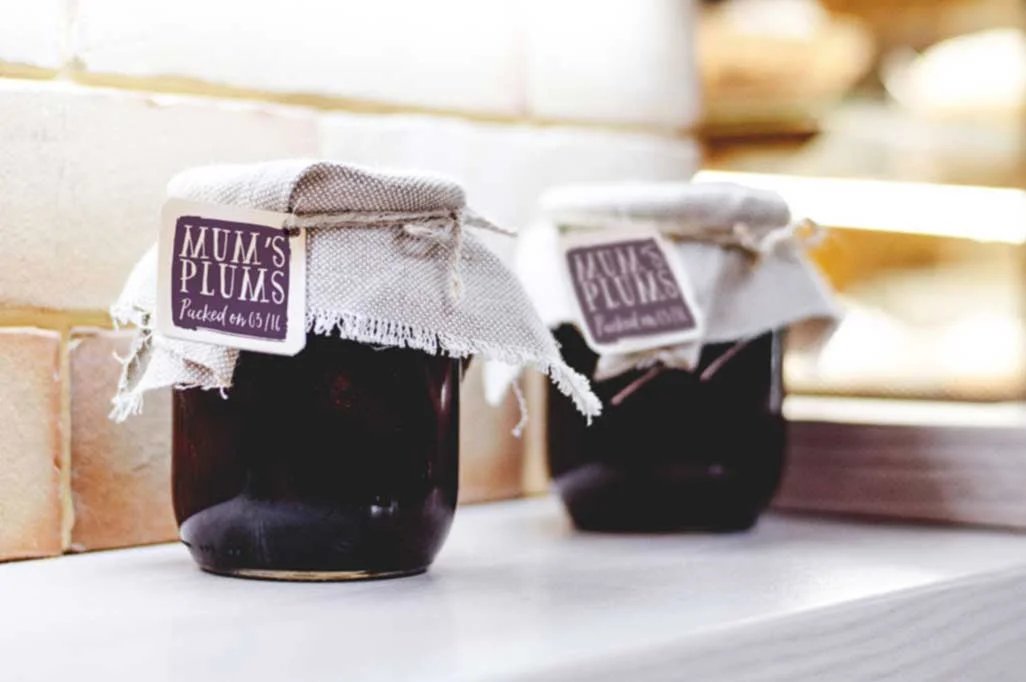 Jam jars with plum jam