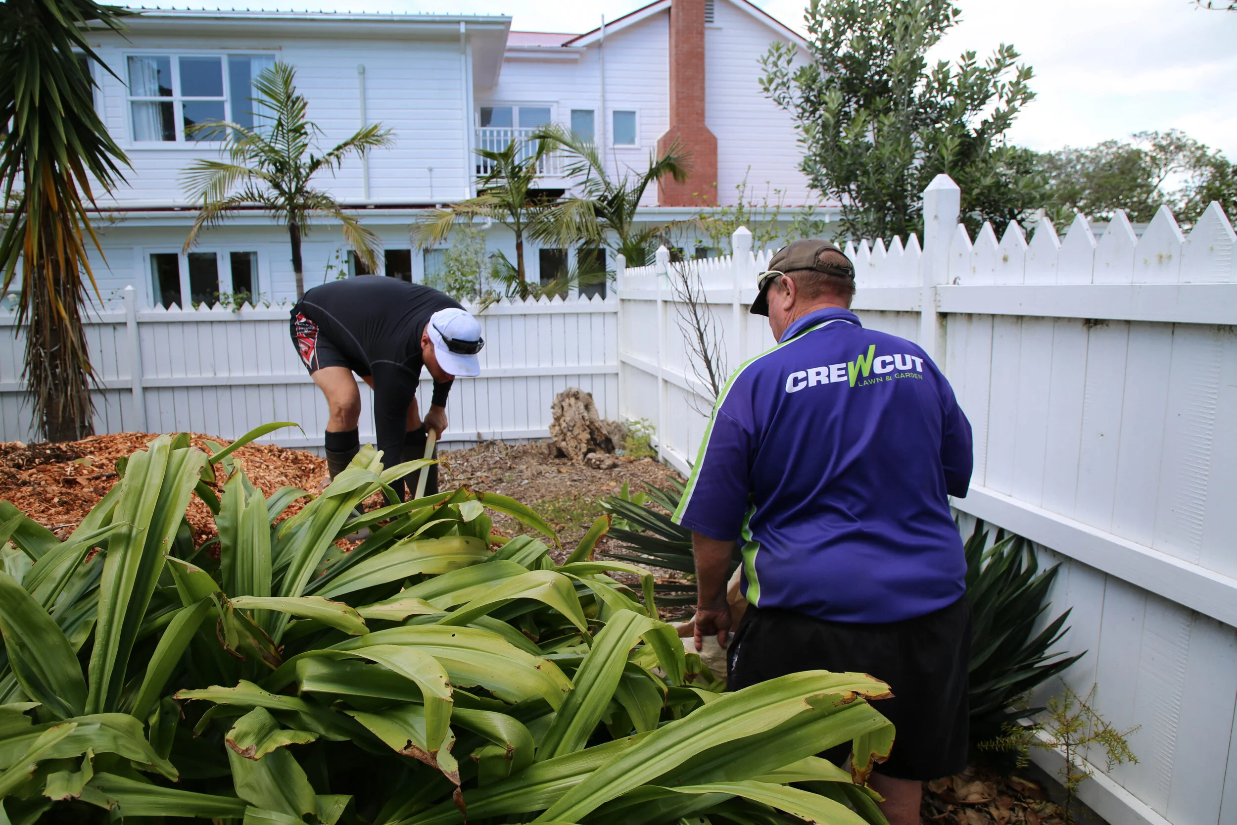 Bruce and Cam working at the Russell Police Station grounds