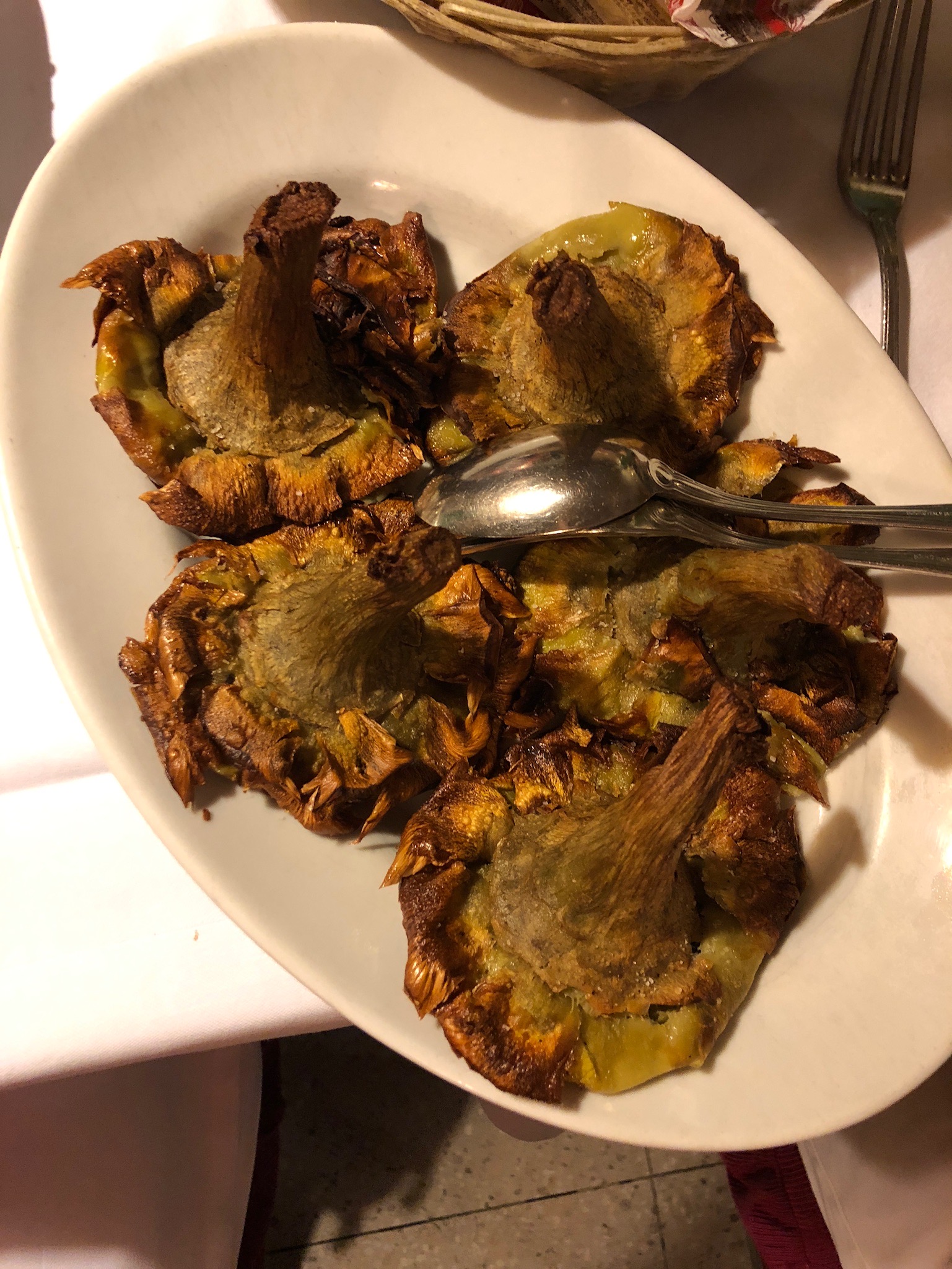 One of the most classic appetizers in Rome that you can find in restaurants or sold by the street vendors is fried artichoke flowers. We were unsure if it was customary to eat the entire thing, stems and all. But we had no problem eating it! So delicious and also not a common way to cook artichokes in U.S. establishments.